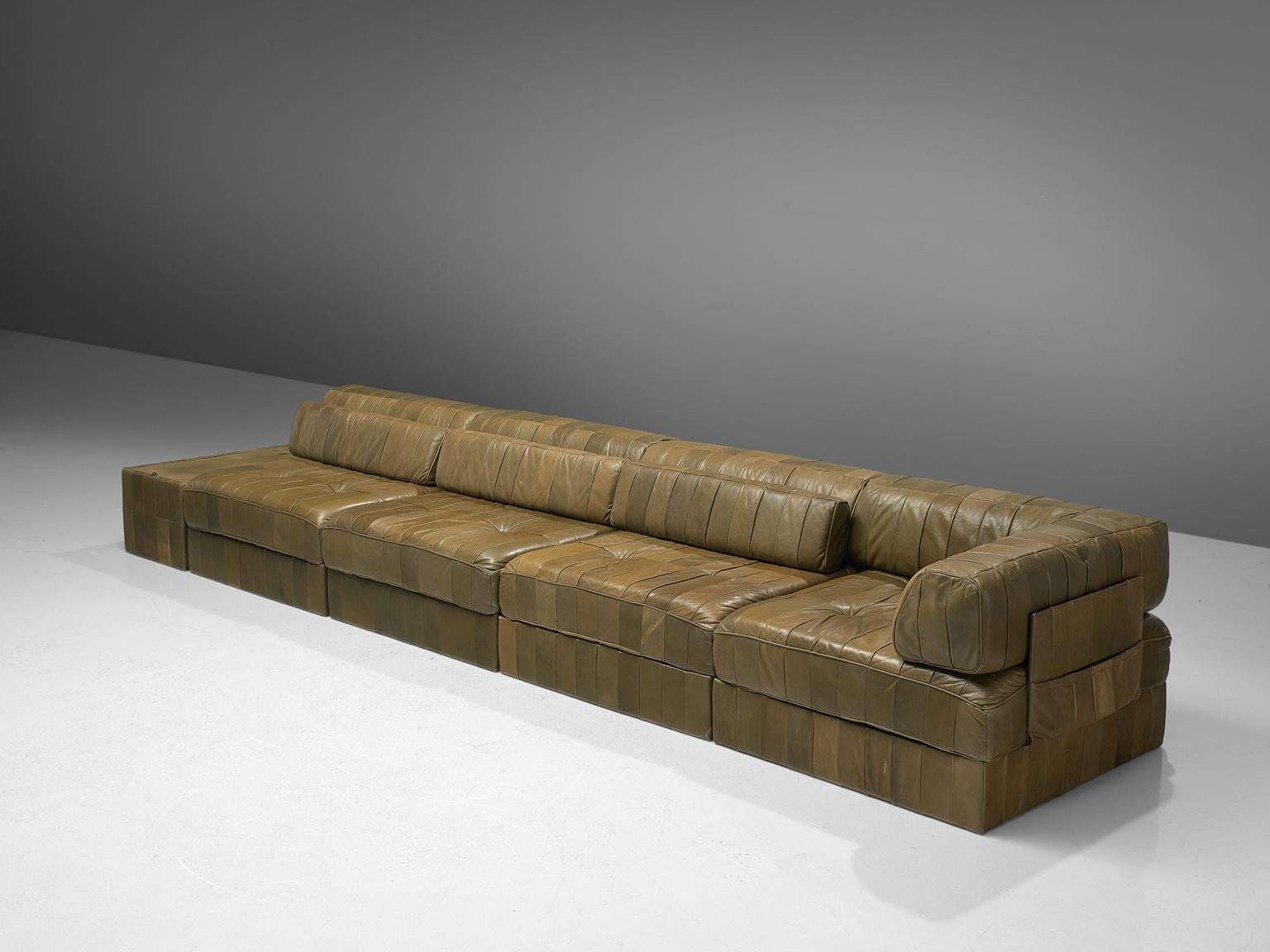 De Sede, sofa, DS 88, olive green patinated leather, 1970s. 

This comfortable leather sofa is made by quality manufacturer De Sede in Switzerland. Known for its craftsmanship, highest quality leather, and unique aesthetics, De Sede manufactures