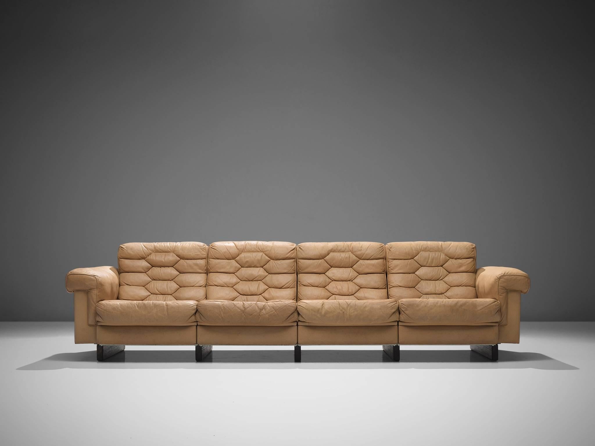 Robert Haussmann for De Sede, four-seat sofa, cognac leather, 1960s.

This sofa is designed by Robert Haussmann for De Sede. The piece defines itself by diamond, honeycomb shaped tufted sections that are visible on seats and backs. The sofa is