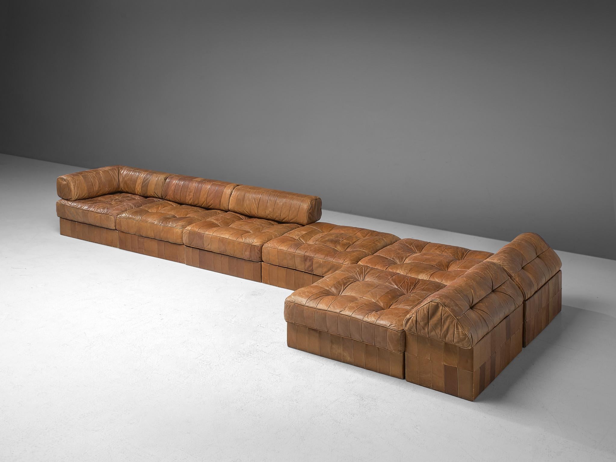 De Sede, modular sofa, cognac patinated leather, Switzerland, 1970s. 

This comfortable leather sofa is made by quality manufacturer De Sede in Switzerland. Known for its craftsmanship, highest quality leather and unique aesthetics, De Sede