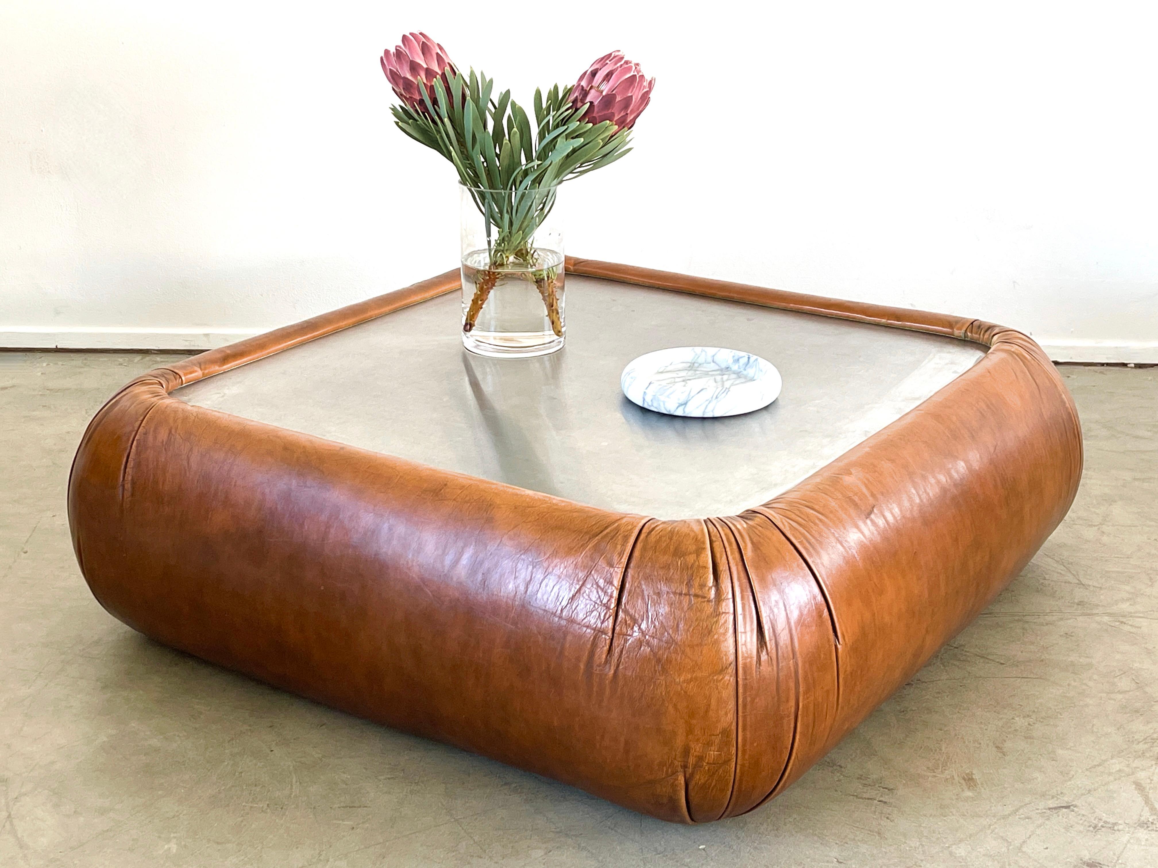 1970's Leather coffee table by De Sede with great patina to leather and aluminum top.