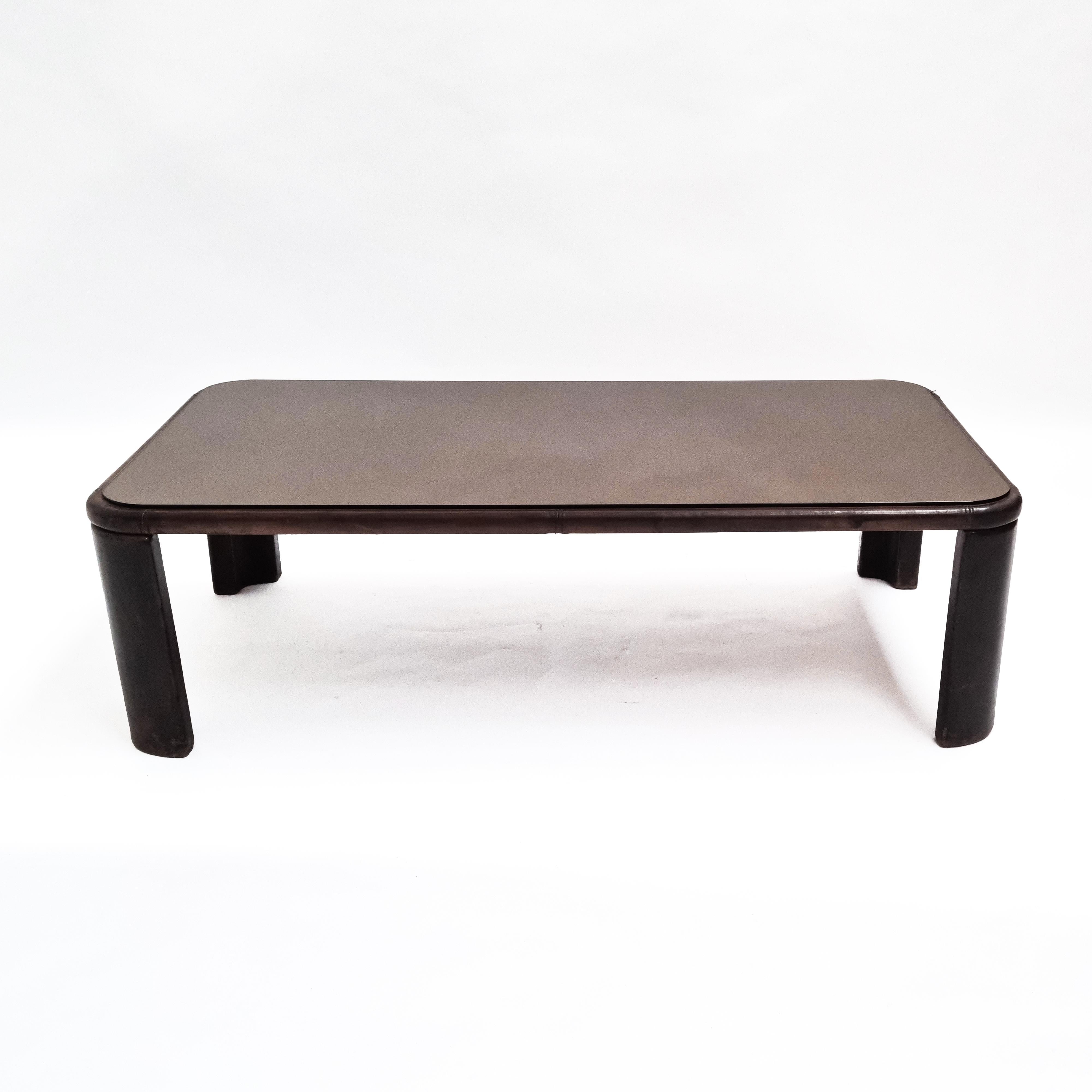 De Sede coffee table, Switzerland, 1970s, completely covered in dark brown leather and smoked glass top. A nice addition to your living room set!