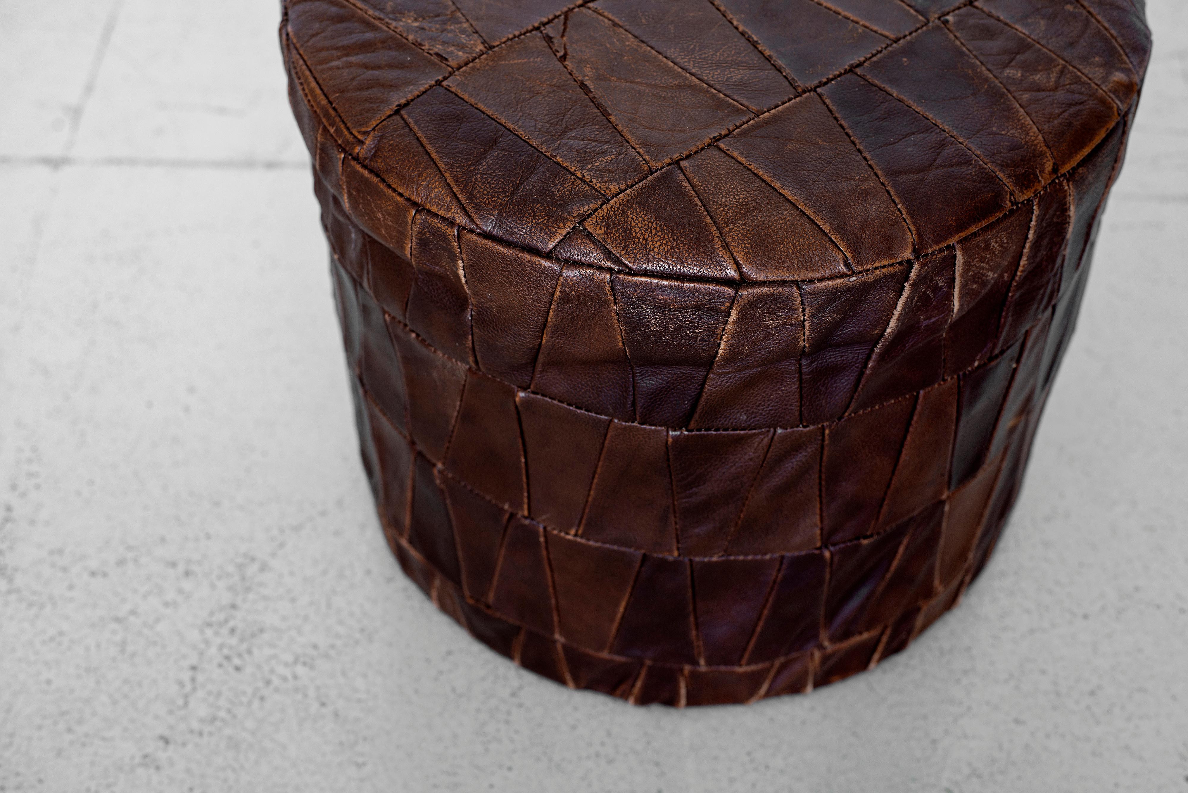 Great vintage leather ottoman by De Sede. Original brown leather patches with nice aged patina and coloring.