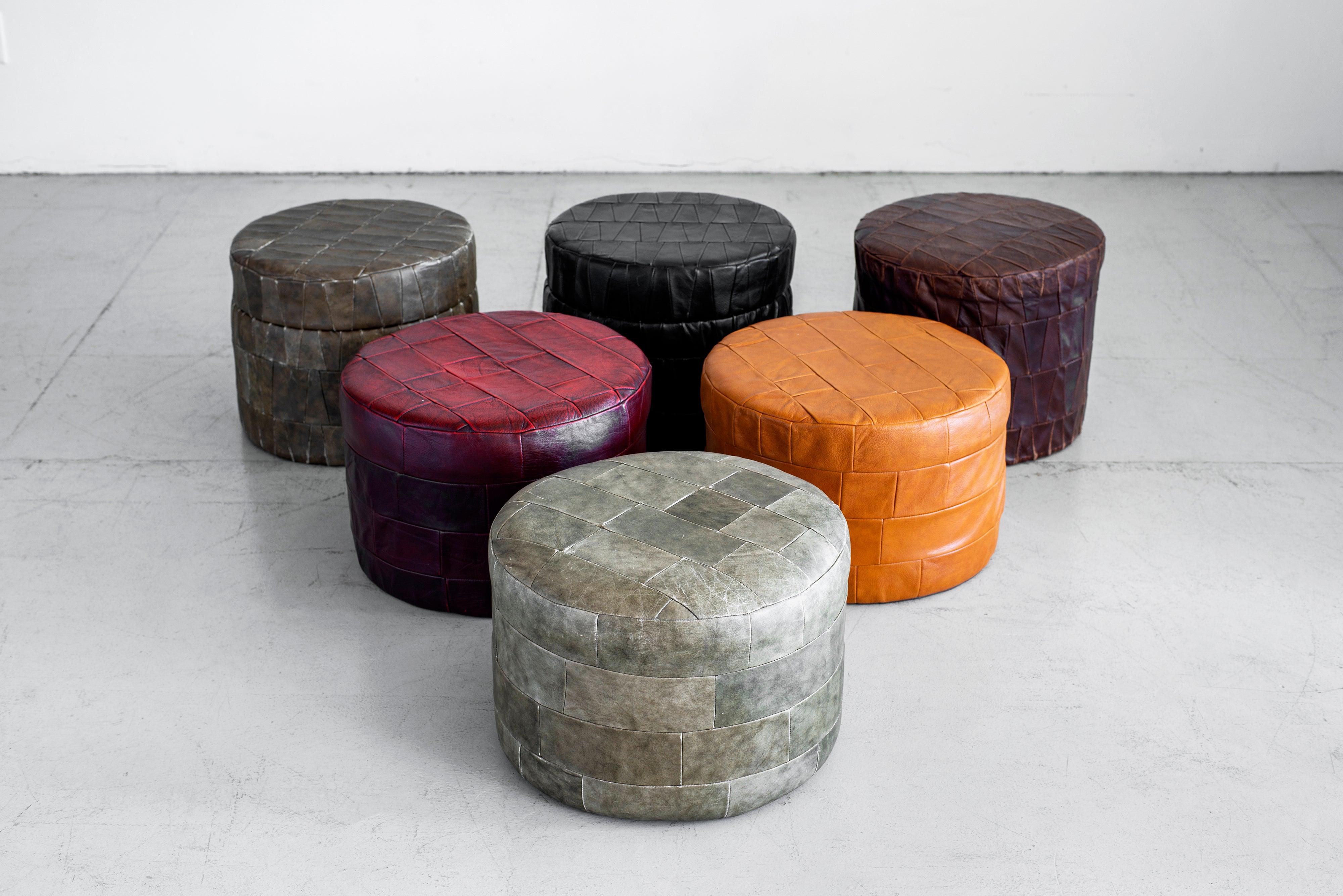 Large collection of patchwork leather ottomans by Swiss designer De Sede. Original soft leather with beautiful patina and age. 

Storage ottomans with open top - $1600 each 
Closed ottomans - $1200 each

Multiple colors, sizes and shapes