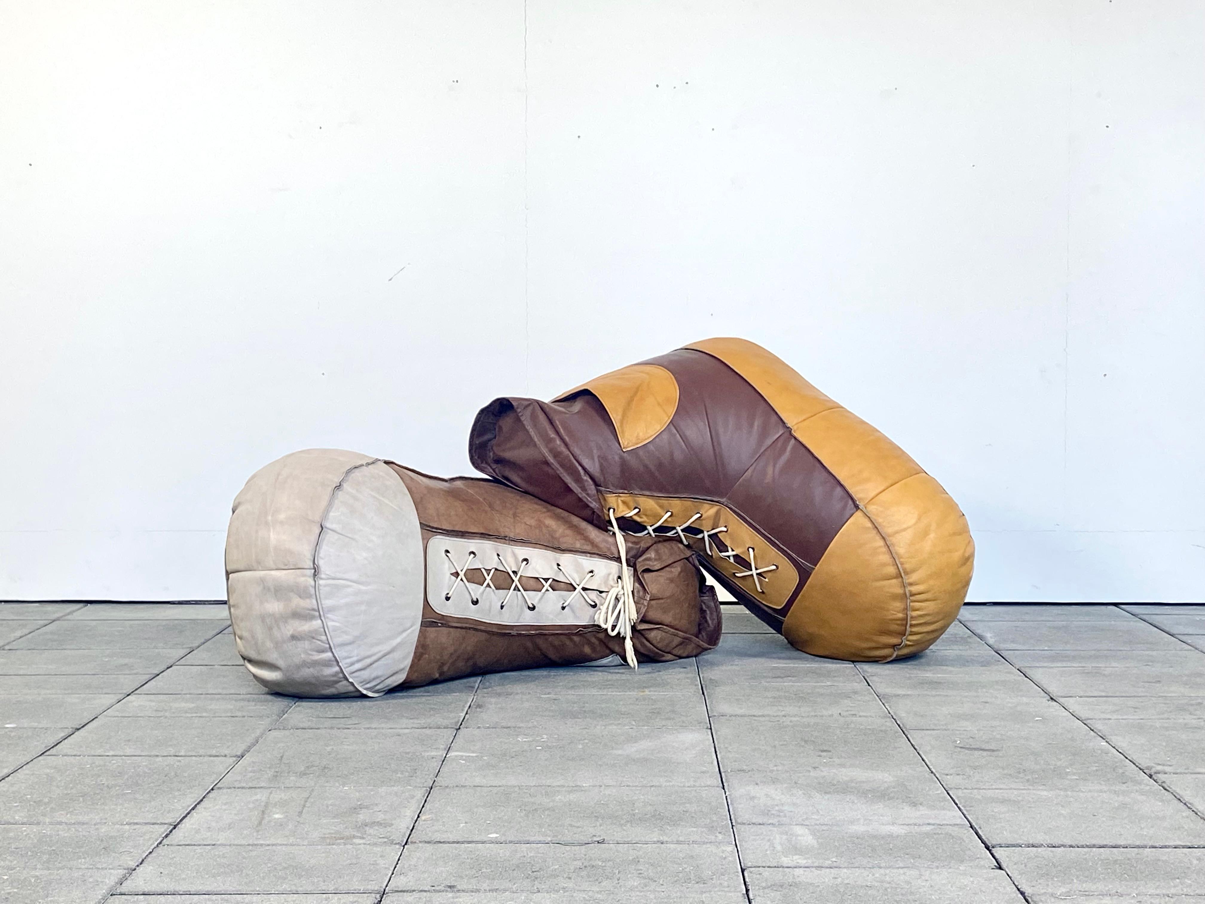 A pair of handmade De Sede leather bean bag shoes, to be used as a pouf, kids setee or ottoman or rather for decorative use as a living room sculpture, designed by Susi and Ueli Berger, Switzerland.

Very few of these shoes have been manufactured