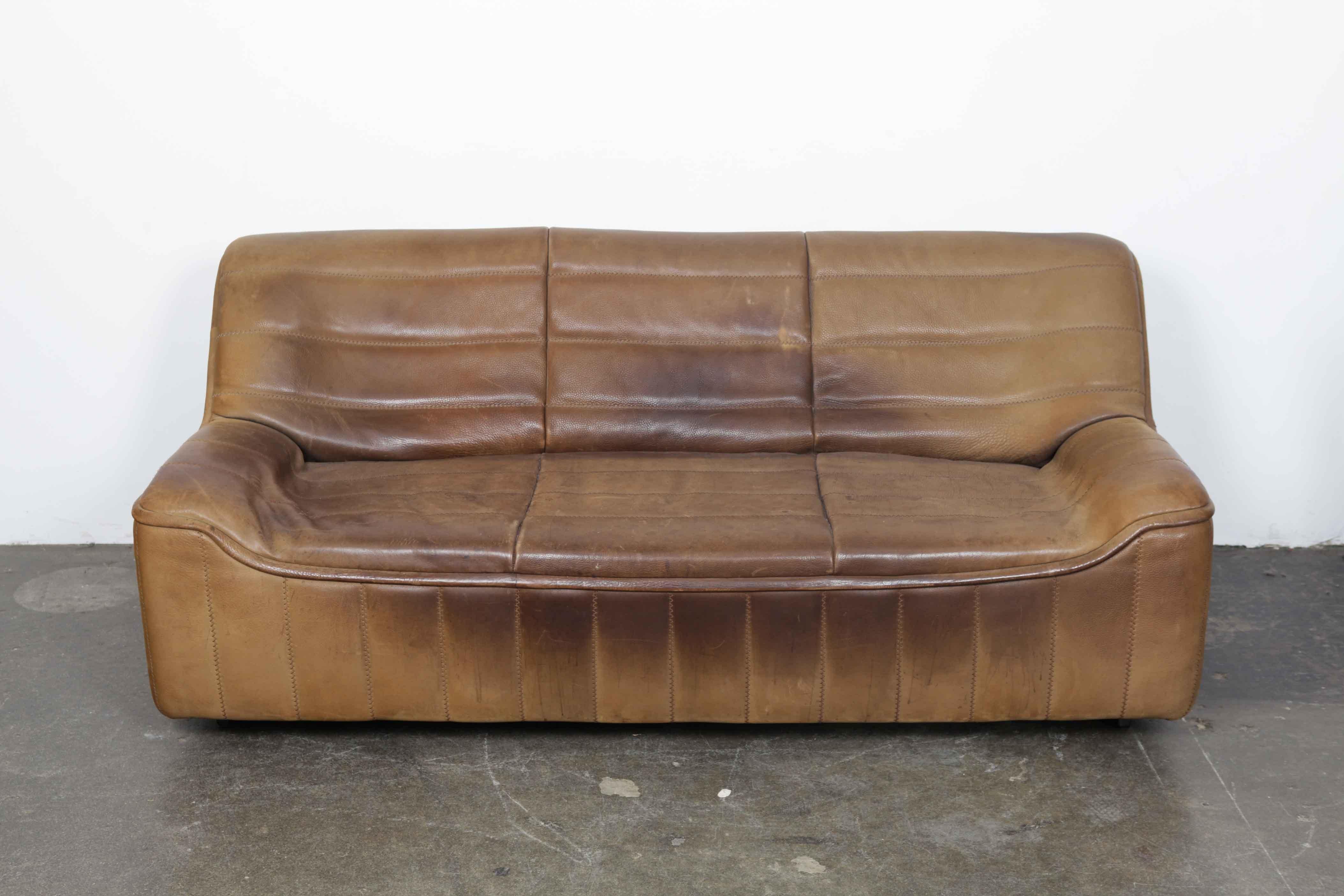 Brown leather three-seat sofa made by De Sede, Switzerland, model DS 84, with original buffalo leather that has vintage wear and patina as seen in the photos.