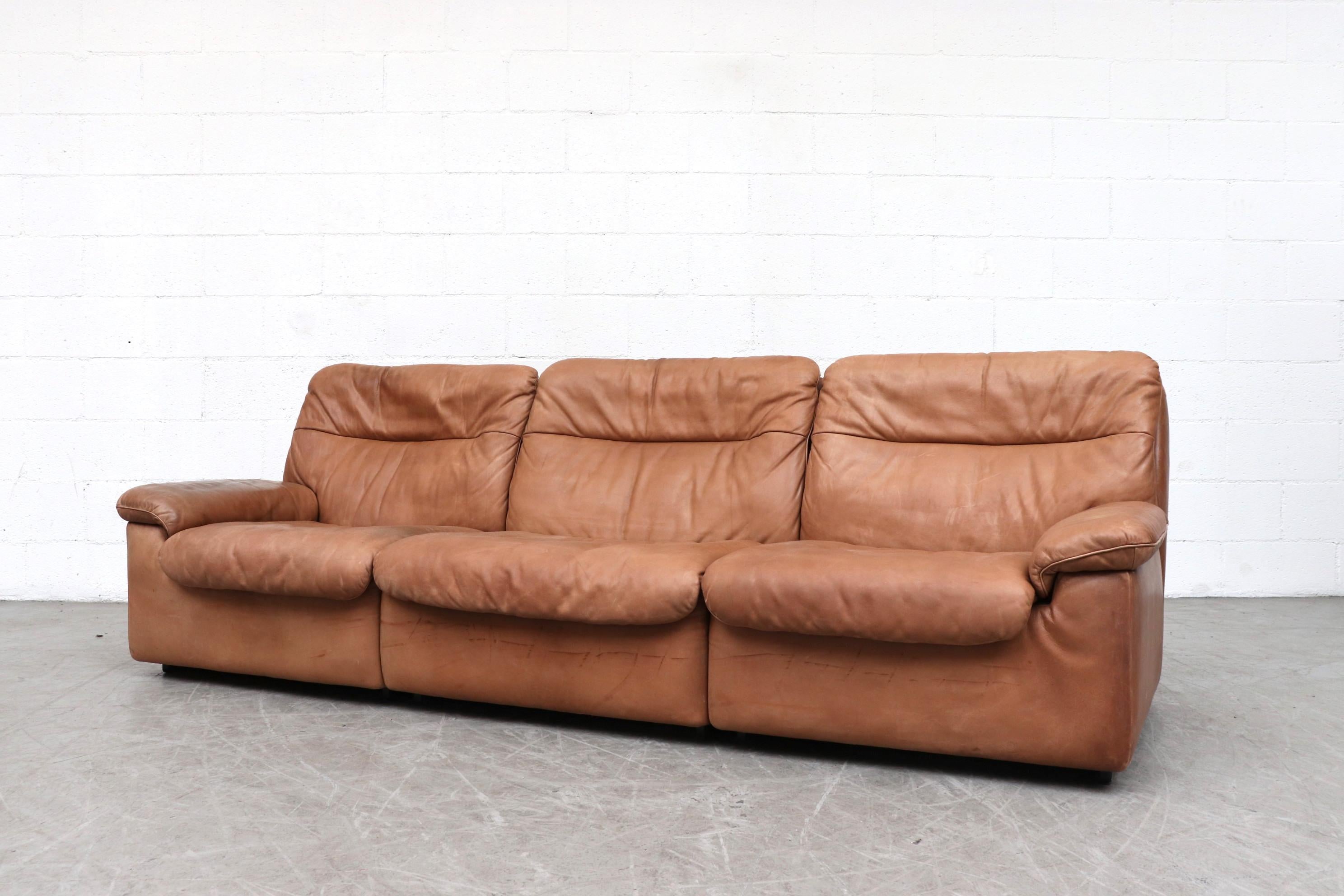 Handsome De Sede DS 66 natural leather 3-Seat Sofa. Thick light brown leather with nice patina. In original condition with some signs of wear consistent with age and use. Matching loveseat (LU922413830531) and lounge chair available