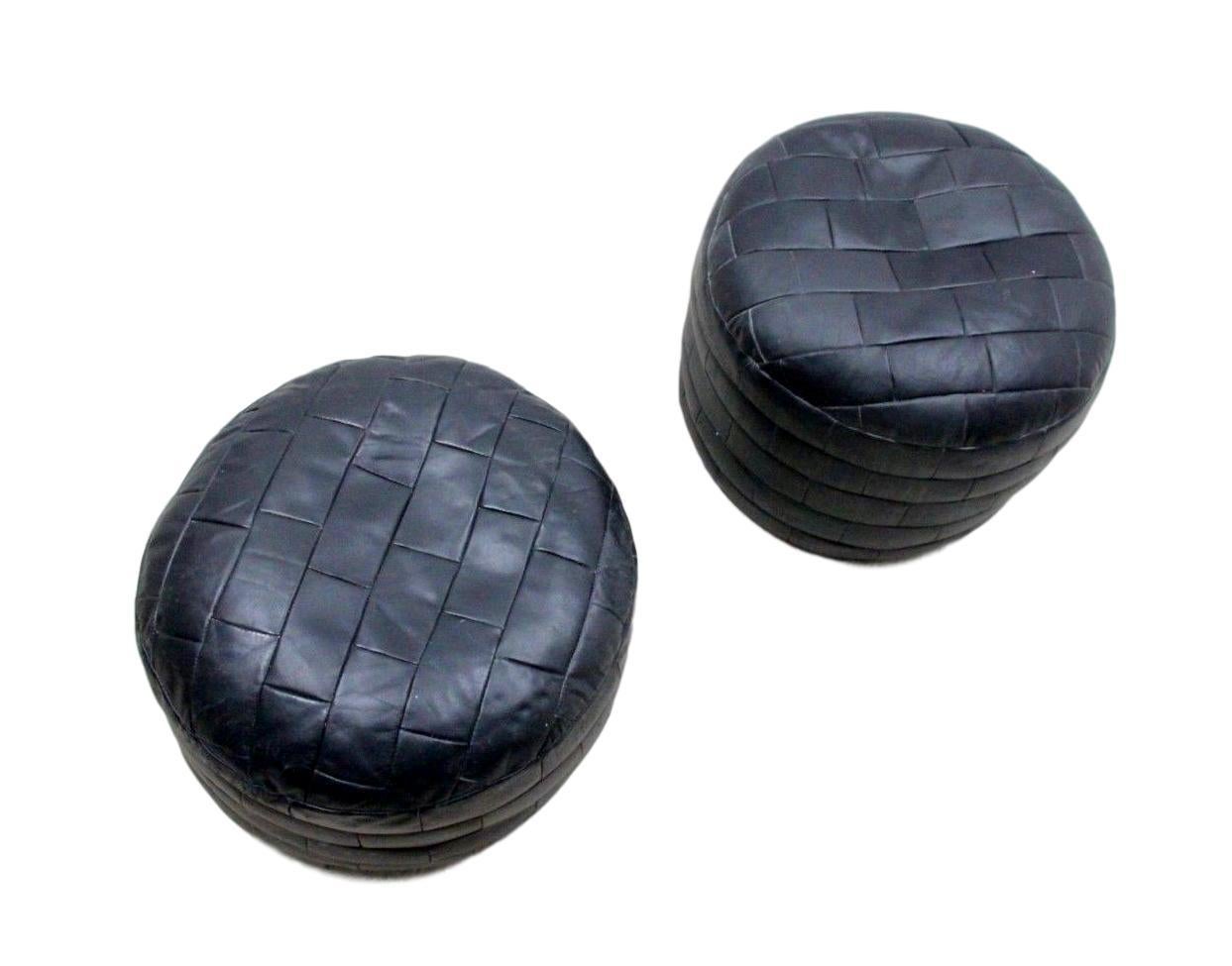 Gorgeous patchwork black leather ottomans by De Sede. Great coloring and patina to leather. Very good condition.

Two available. Priced individually.