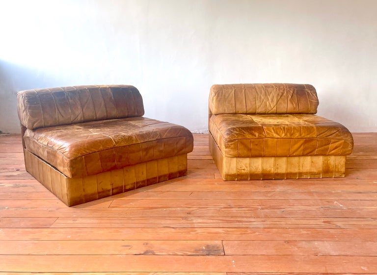 Patchwork leather modular chairs by De Sede
Switzerland, 1970's 
Beautiful patina to patchwork caramel leather. 
Matching sofa /chaise sold separately - which could create a sectional. 

