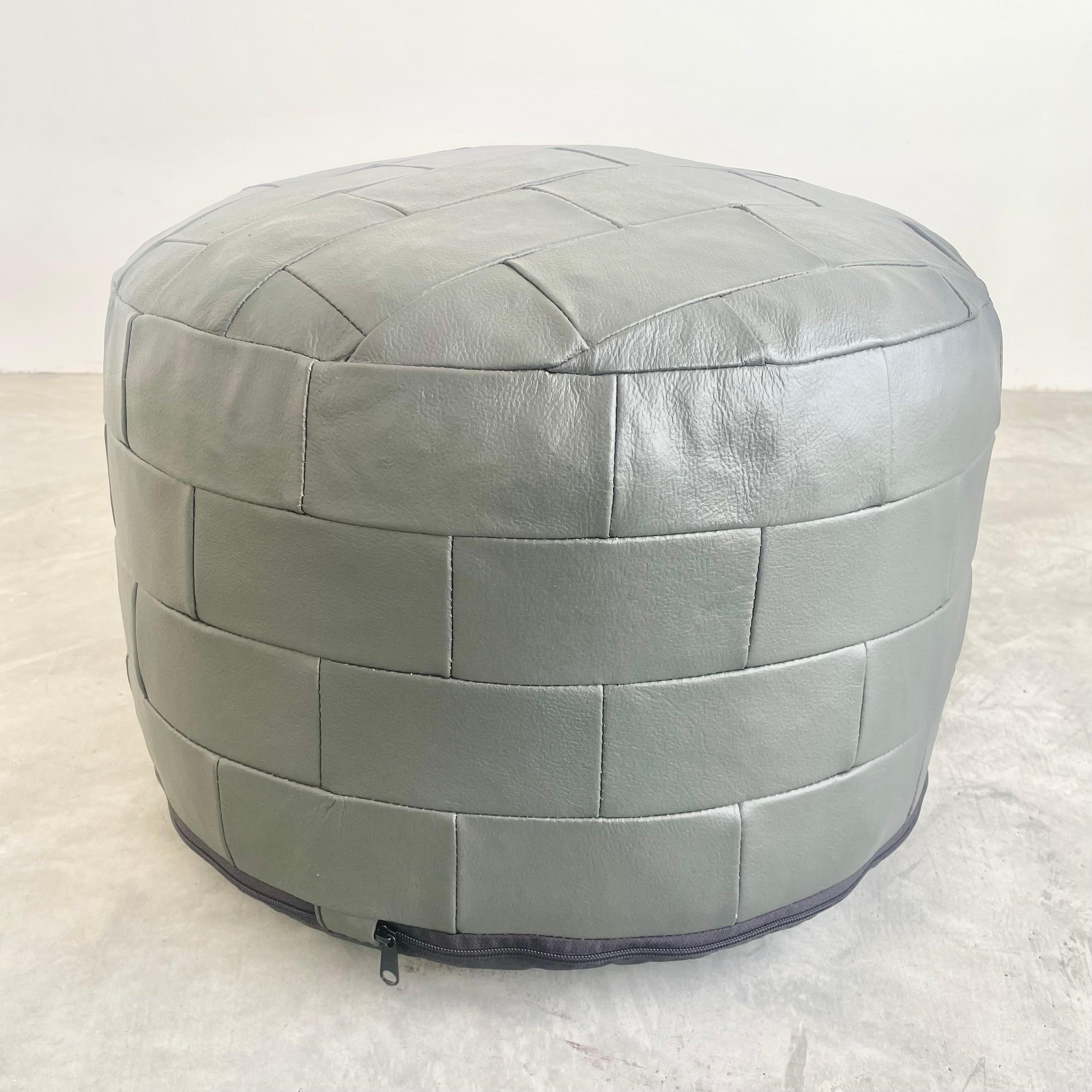 Gorgeous grey colored leather pouf by Swiss designer De Sede with square patchwork. Perfect accent piece. Good vintage condition with new rubberized bottom.

