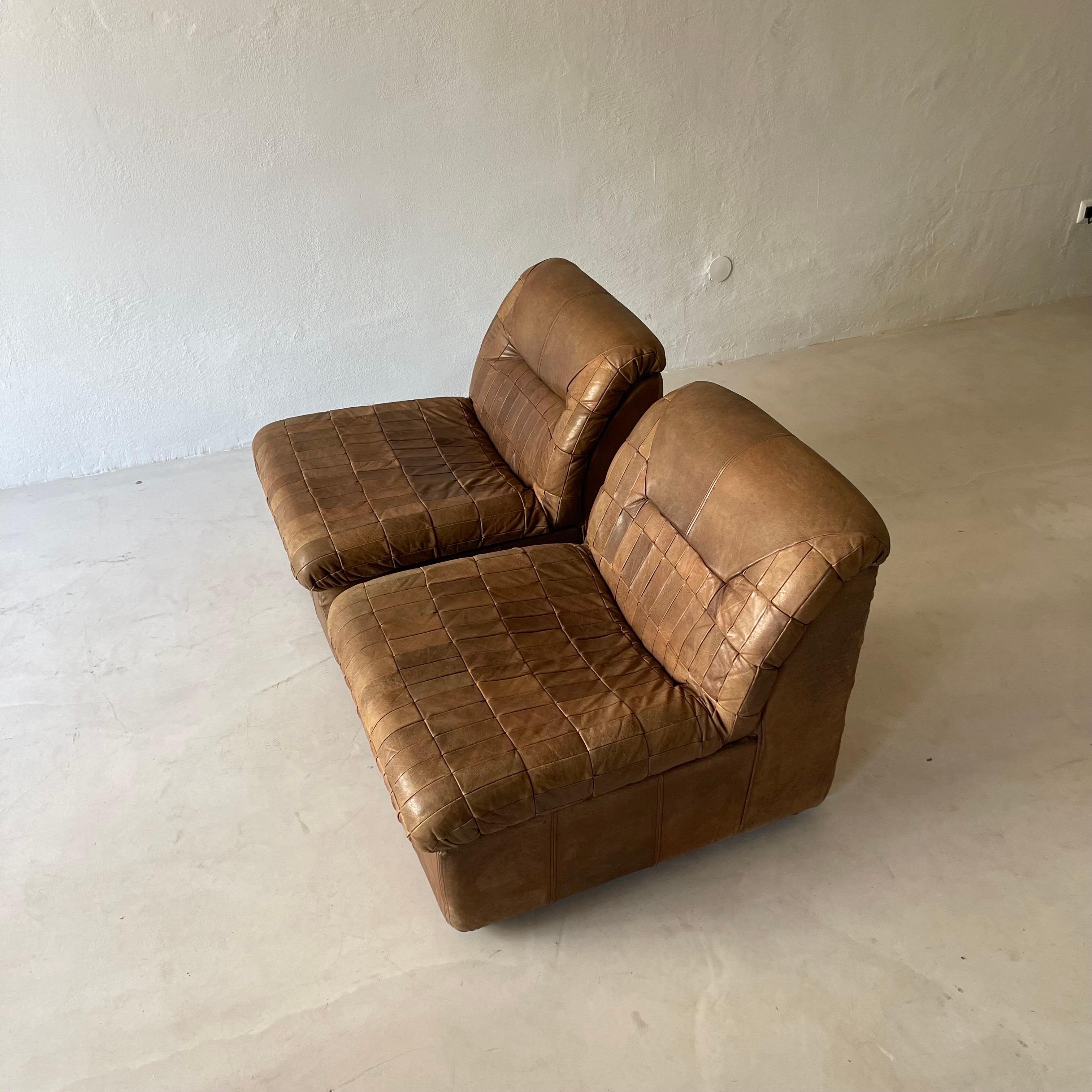De Sede patchwork lounge chairs pair in cognac leather, 1970s.