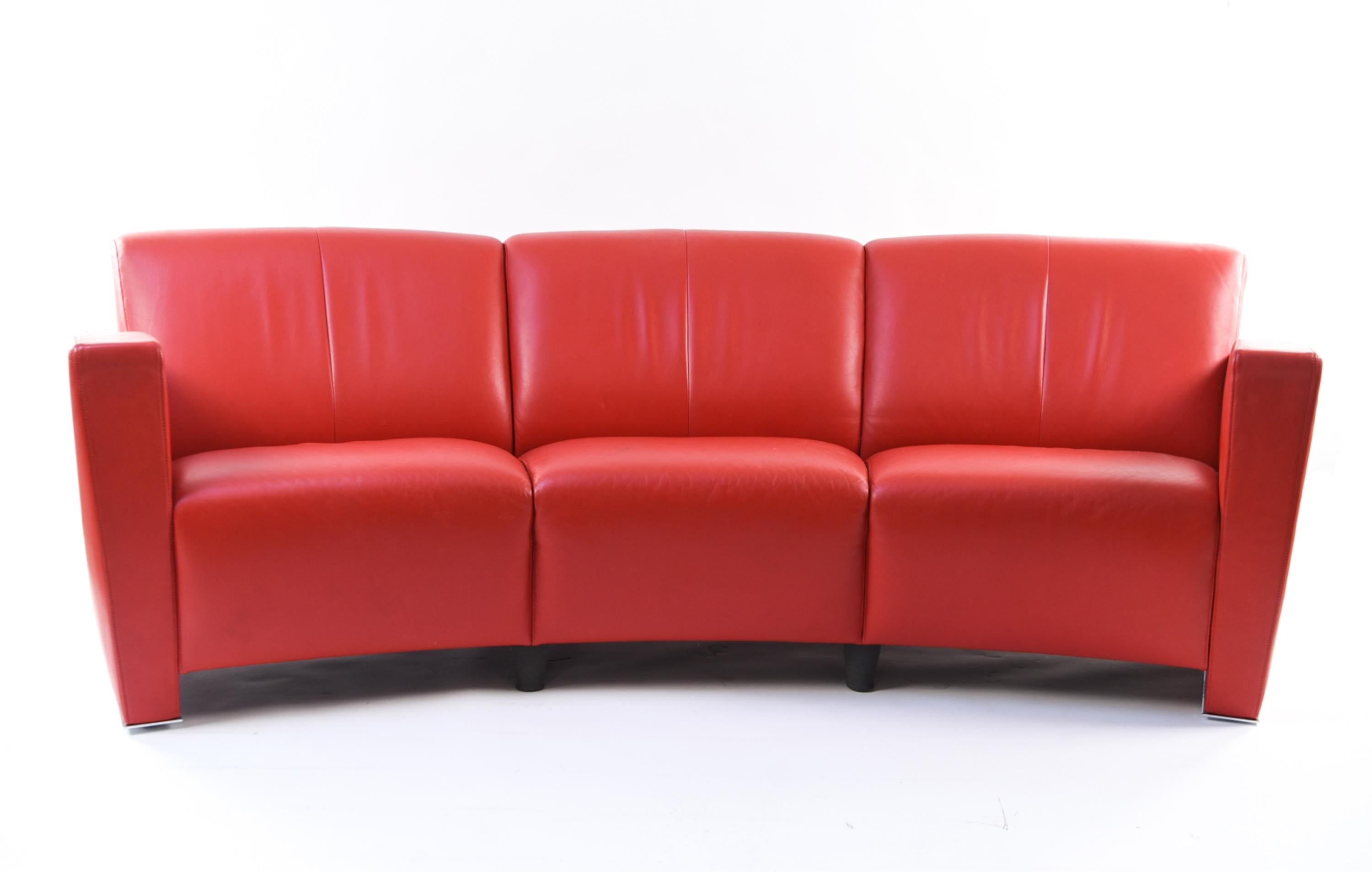 This eye-catching red crescent form sofa will be the statement piece of any living space.