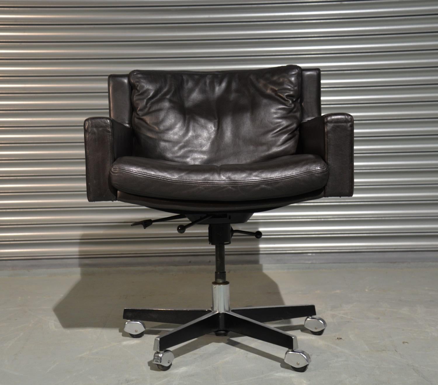 Discounted airfreight for our International and US customers ( from 2 weeks door to door )

A highly desirable vintage Robert Haussmann swivel leather armchair on castors for De Sede. Rarely available and built in the late 1950s by De Sede craftsman