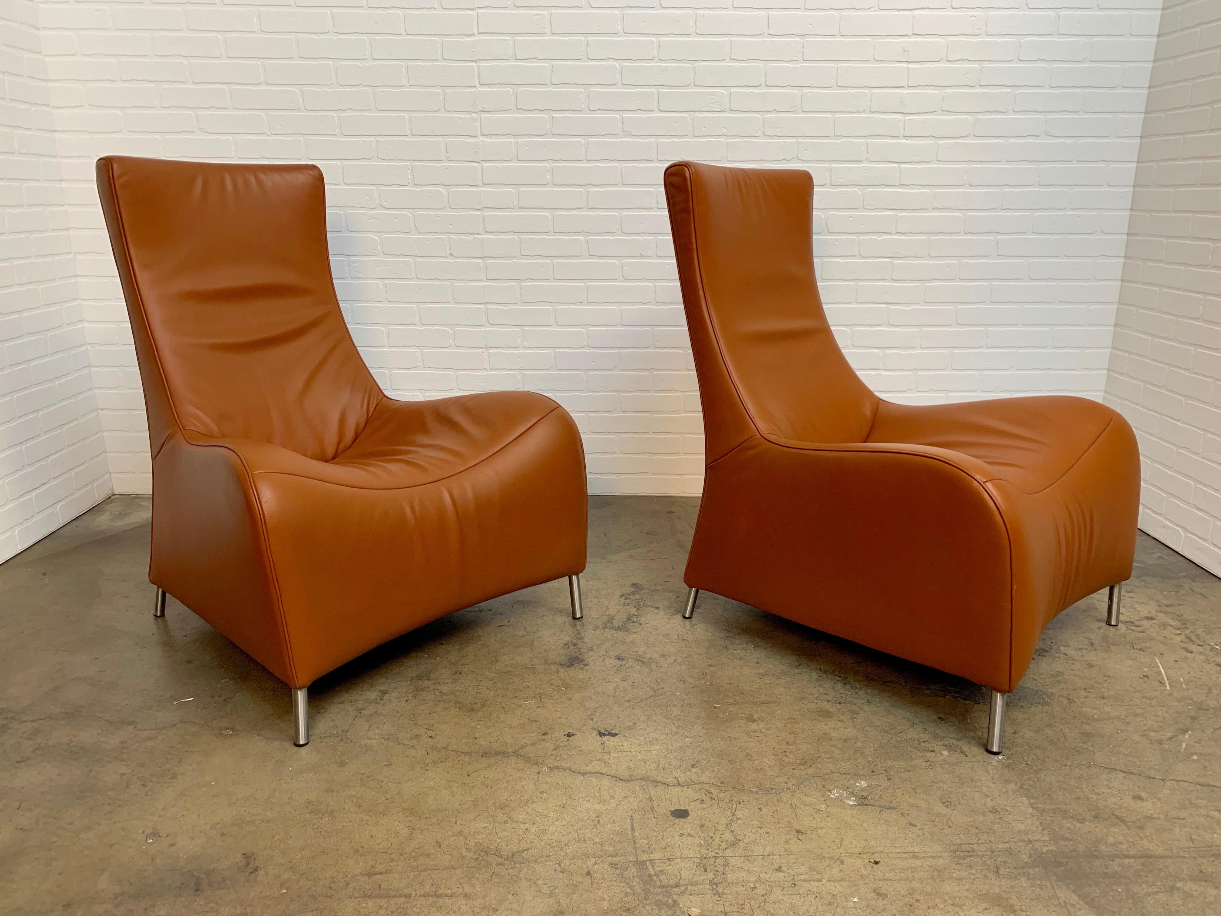 Designed by Matthias Hoffmann for De Sede. Saddle colored leather with stainless steel legs this pair of chairs is very comfortable.