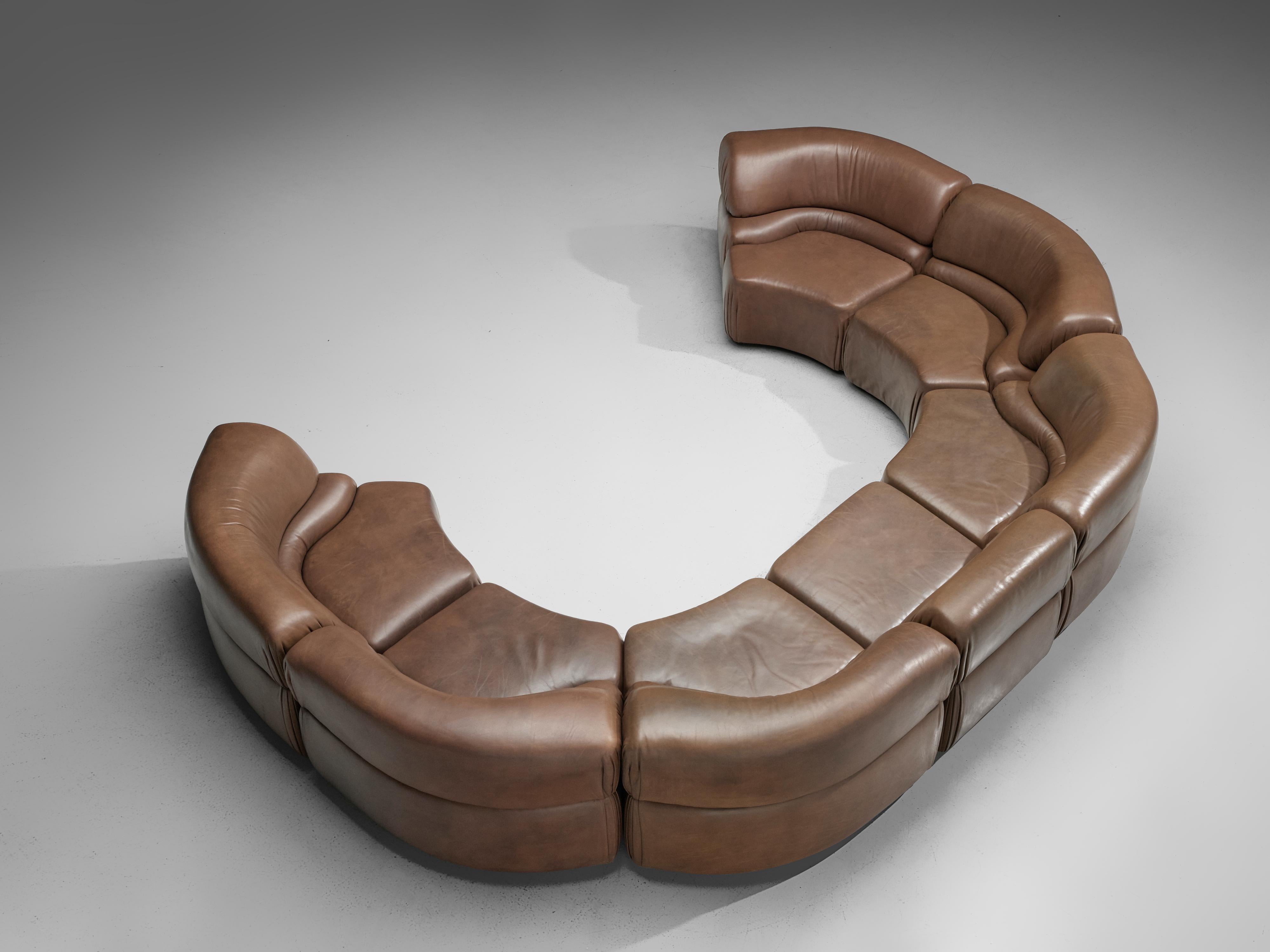 De Sede, 'Cosmos' sectional sofa in seven elements, patinated brown leather, Switzerland, 1970s

High-quality modular sofa made by De Sede in Switzerland in the 1970s. Due to the rounded, separated elements the sofa can be used in a variety of