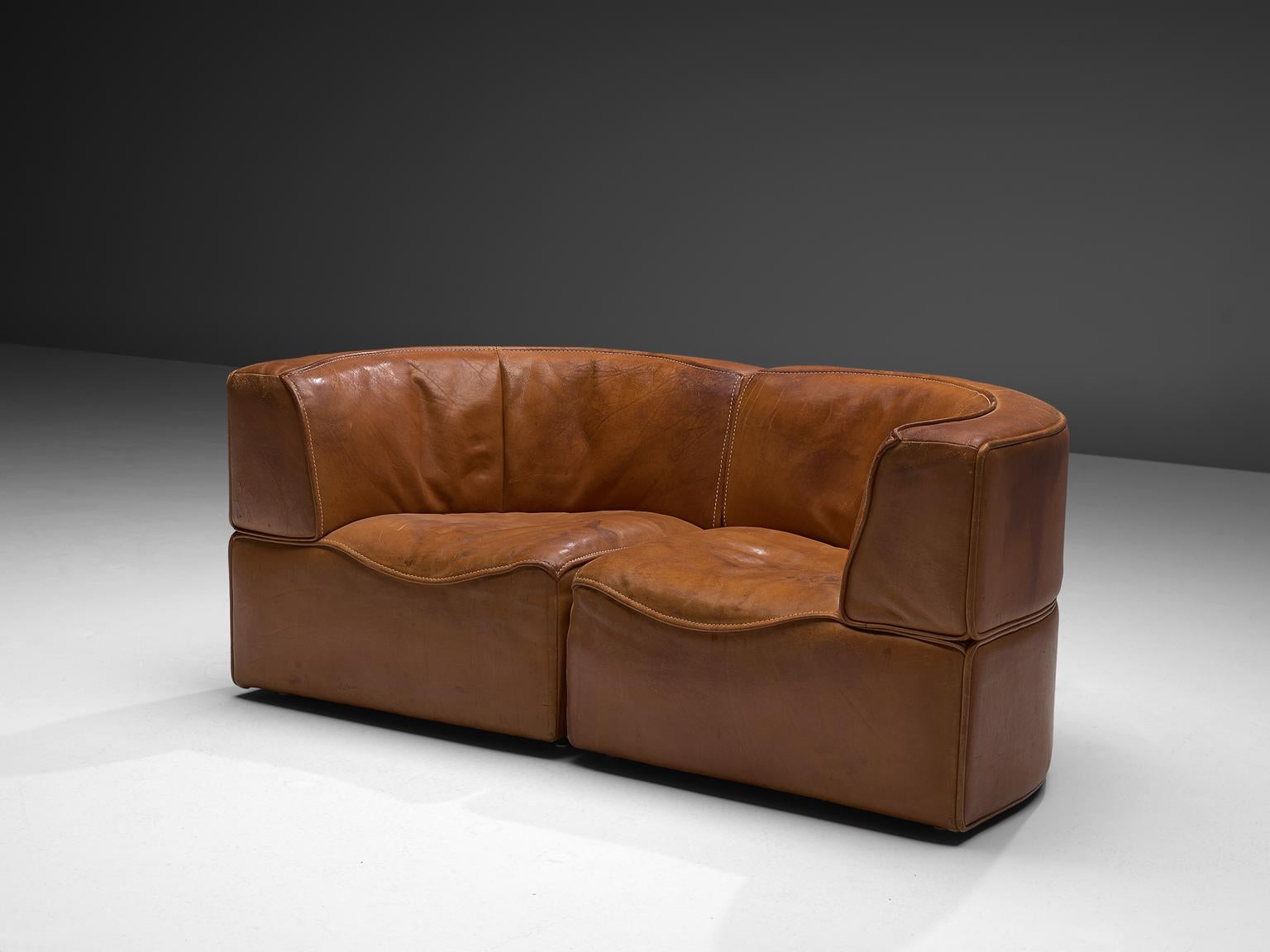 De Sede, sectional sofa model DS-15, cognac leather, Switzerland, 1970s. 

This high quality sectional sofa contains two corner elements. The design is simplistic yet highly comfortable. The tight back shows a nice line of two levels, the front is