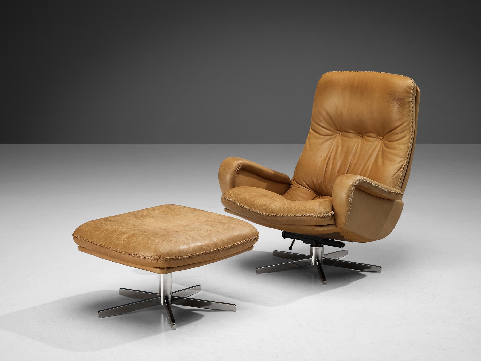 De Sede, set of lounge chair and ottoman model 'S231', patinated leather, chromed metal, Switzerland, 1960s 

This lovely chair by De Sede is based on a solid construction featuring a large backrest and deep seat which offers great comfort to the