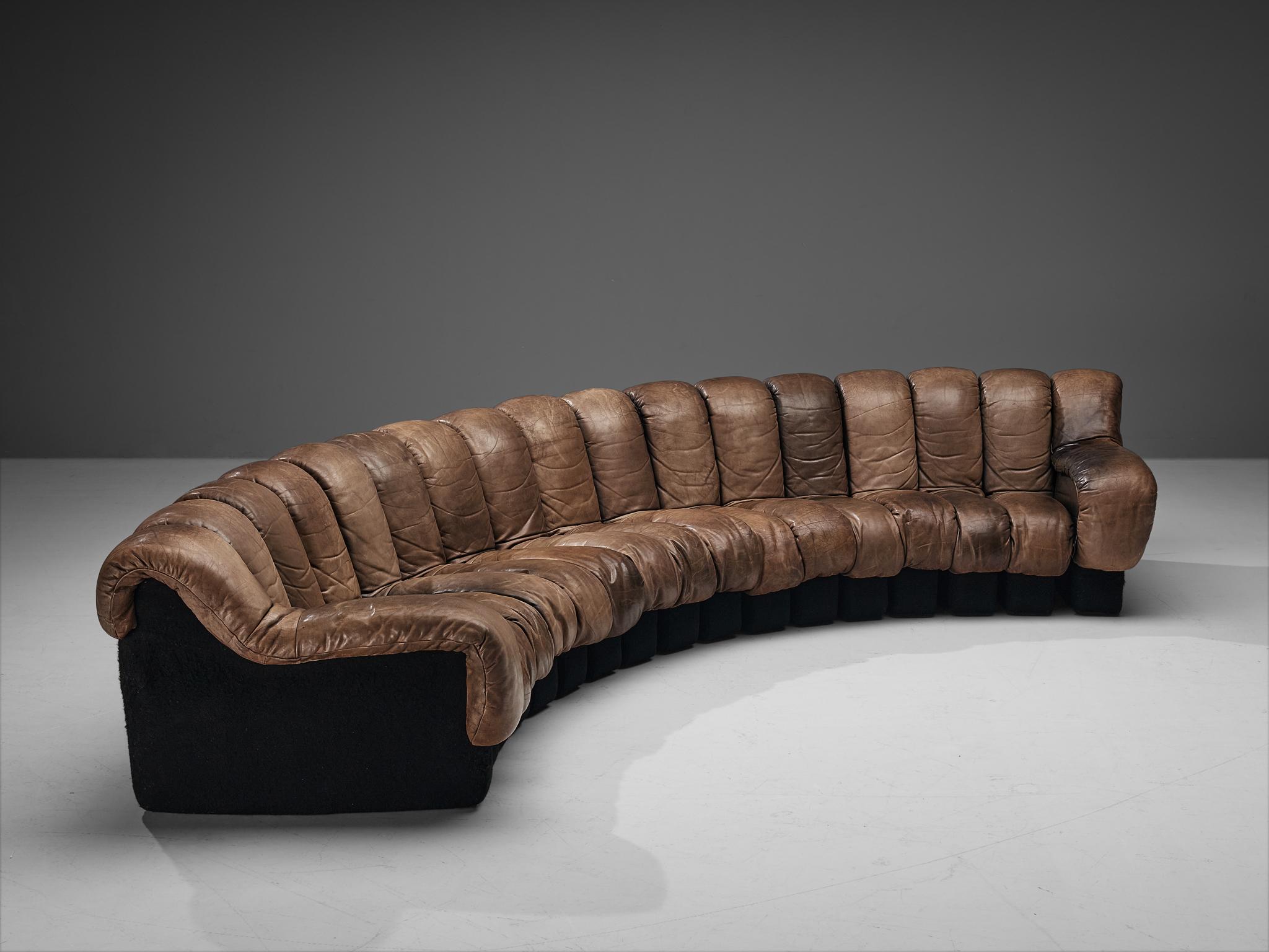 De Sede, ‘Snake’ DS-600, patinated leather, felt, Switzerland, 1972.

A design by Ueli Berger, Elenora Peduzzi-Riva, Heinz Ulrich and Klaus Vogt for De Sede, Switzerland. This De Sede modular 'Snake' sectional sofa contains seventeen pieces in