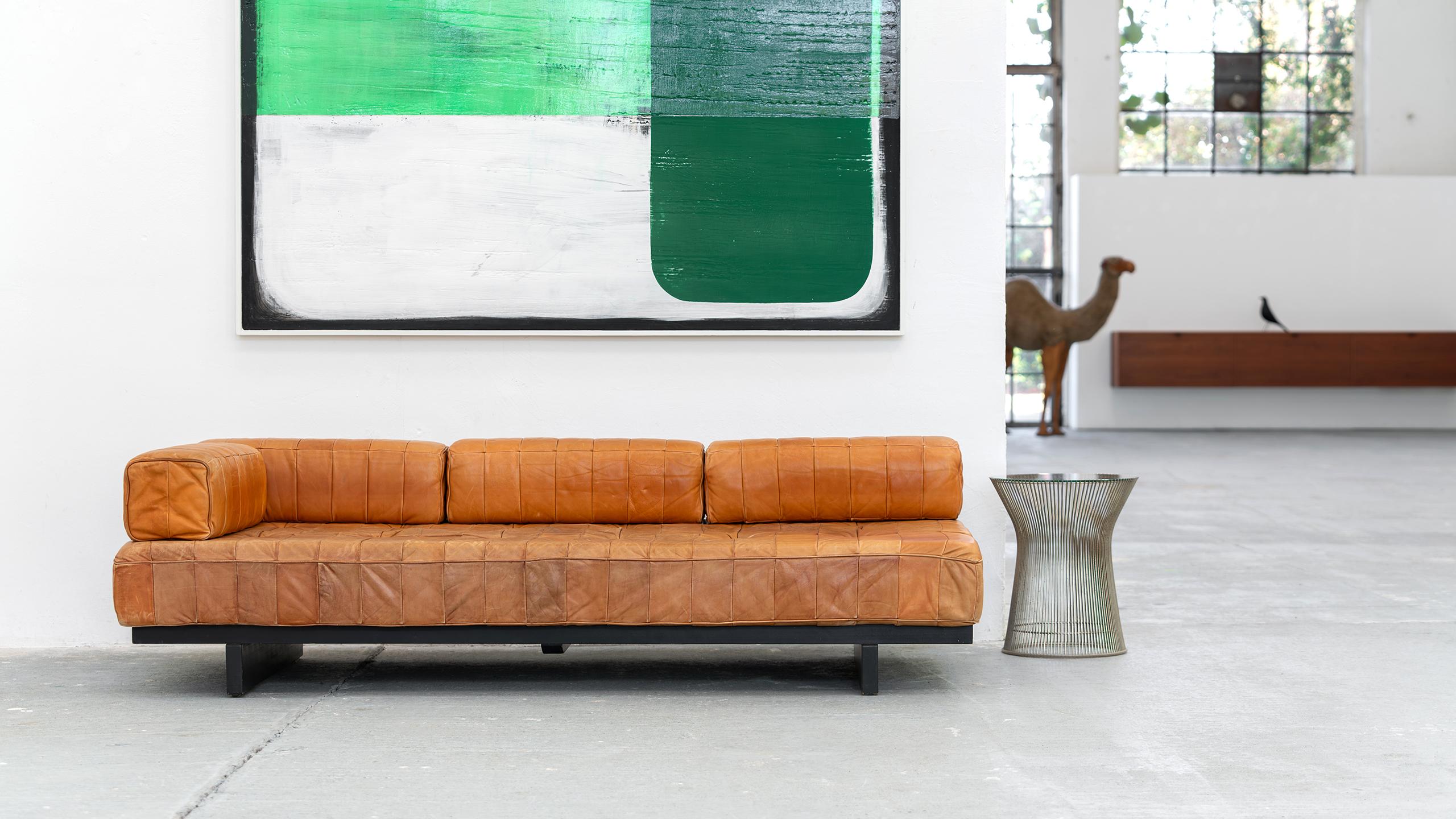 De Sede - DS 80 Sofa + Daybed in cognac patchwork leather.
1969 by De Sede Design Team.

De Sede DS-80 Patchwork Daybed.
The daybed has a black lacquered wooden slatted frame, the backrest can be removed.

The Patchwork series was developed in 1969,