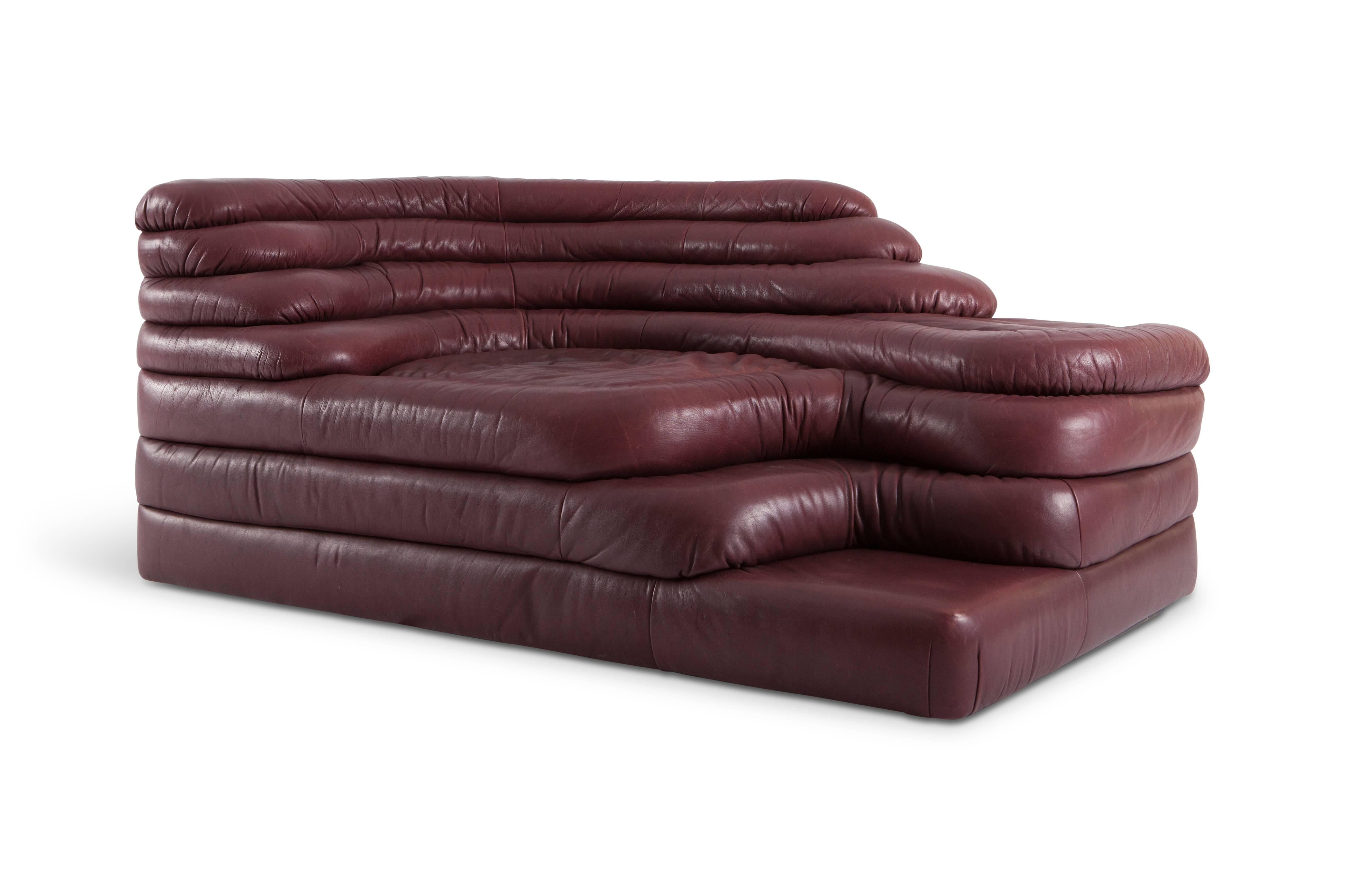 Terrazza Landscape sofa elements in original high quality burgundy leather, set of two
by Ubald Klug for De Sede, Switzerland, 1970s. 

De Sede is well-known for making high end quality sofas with many iconic designs on their pedigree.
This
