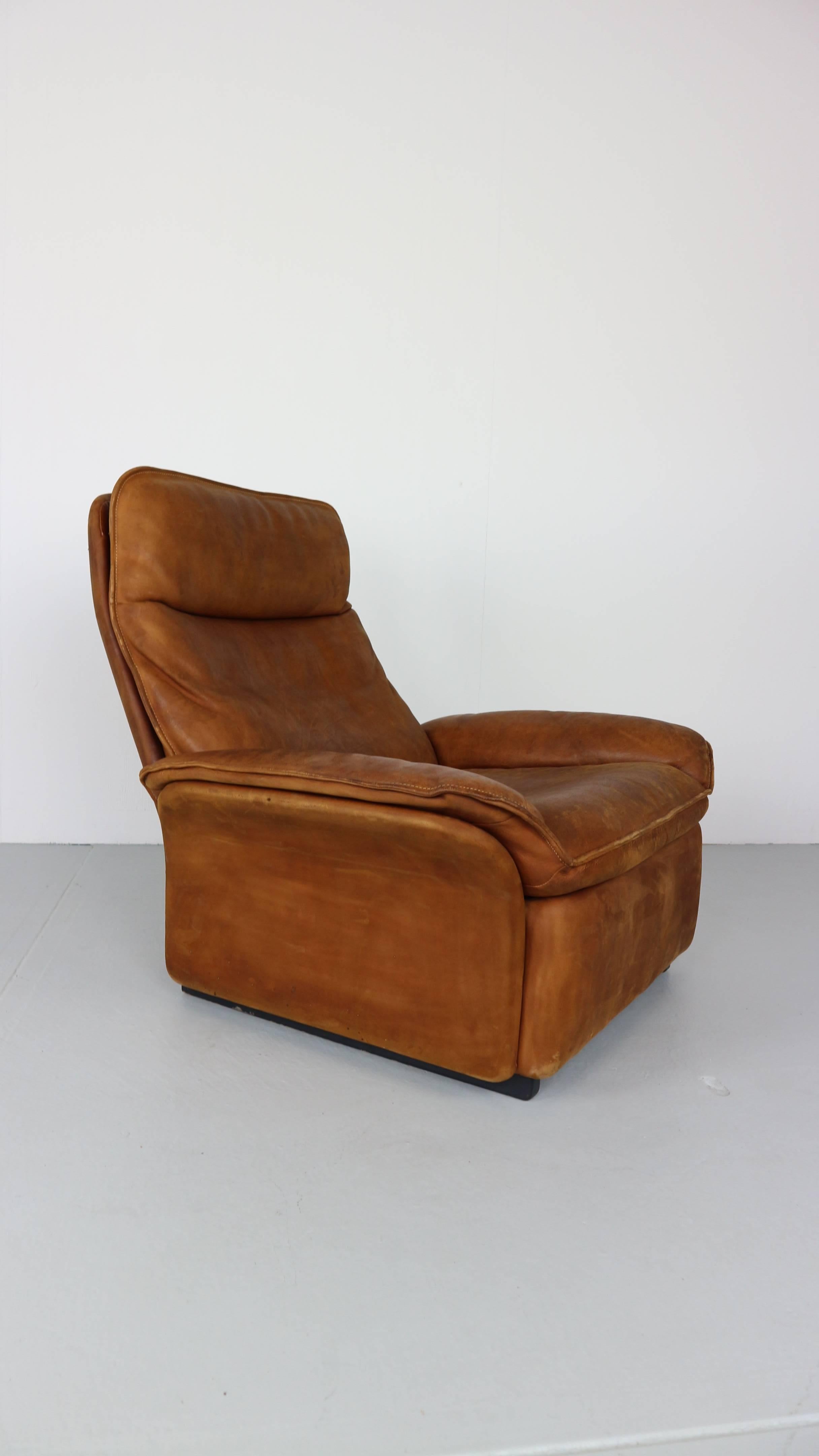 Cognac colored neck-leather easy-chair designed by design team at De Sede. Produced by De Sede in Switzerland, 1970s.