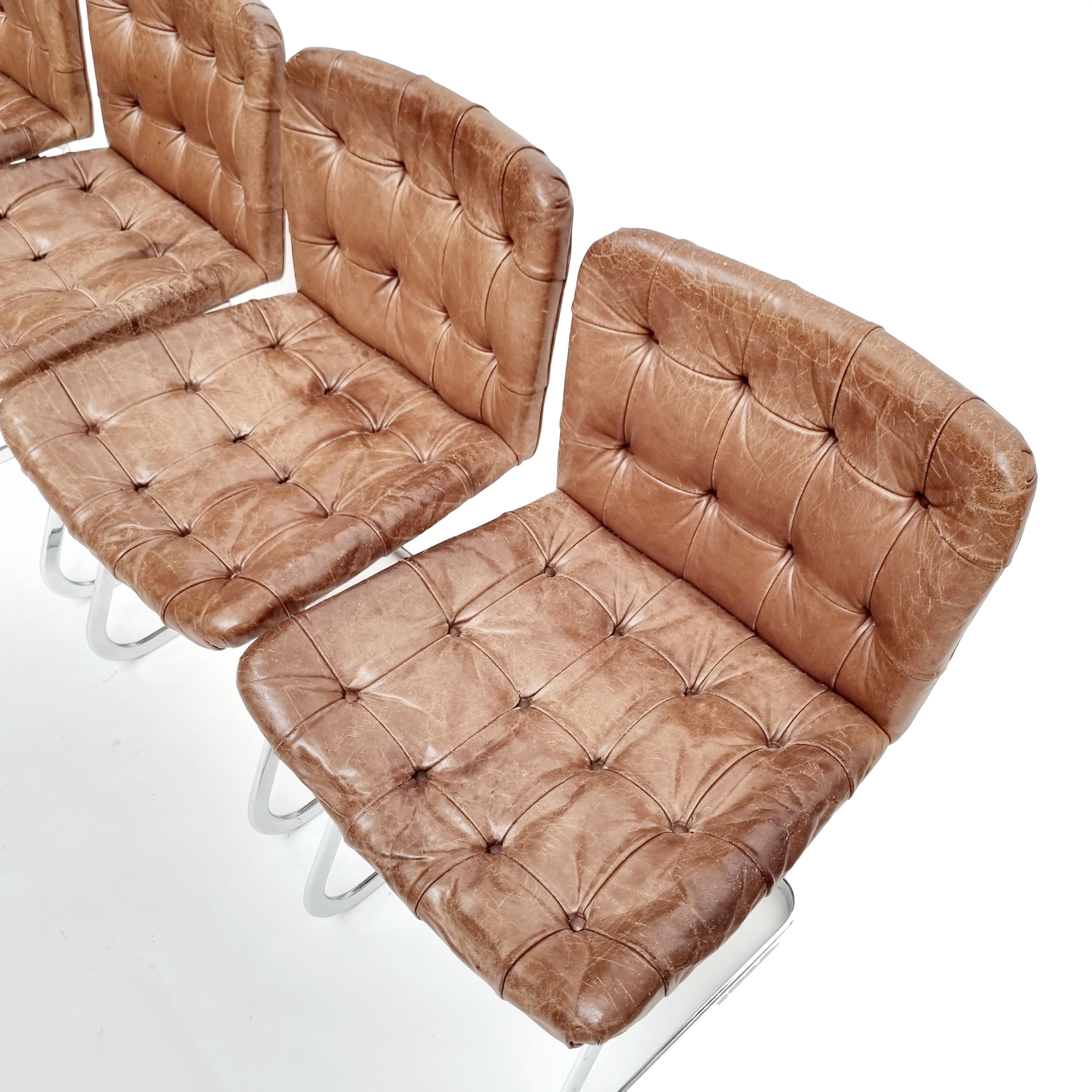 This set of tufted chairs feature a cantilever design.