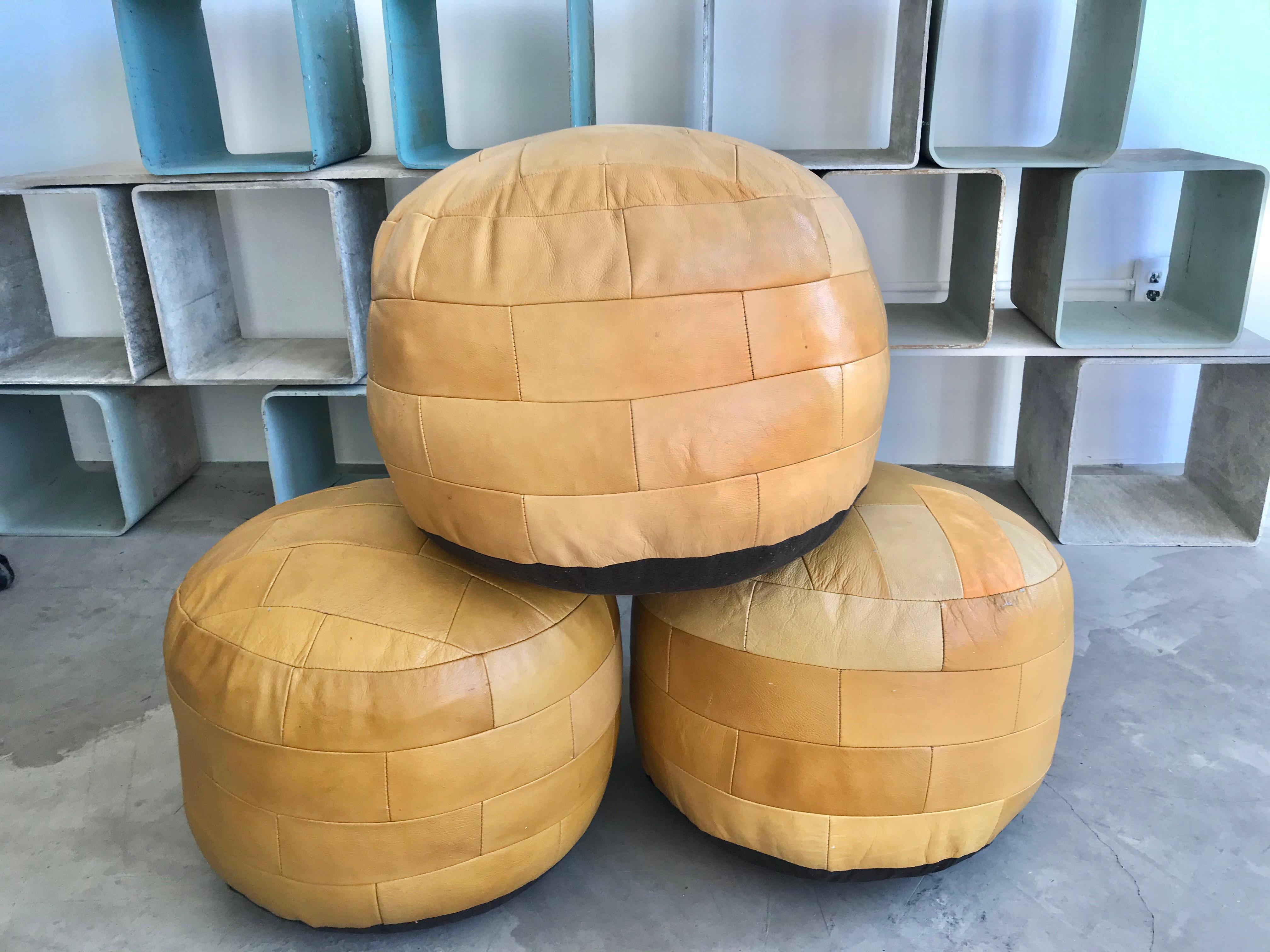 Gorgeous yellow patchwork leather ottomans by De Sede. Great coloring and patina to leather. Very good condition.

3 available in in various degrees of patina. Priced individually.

 