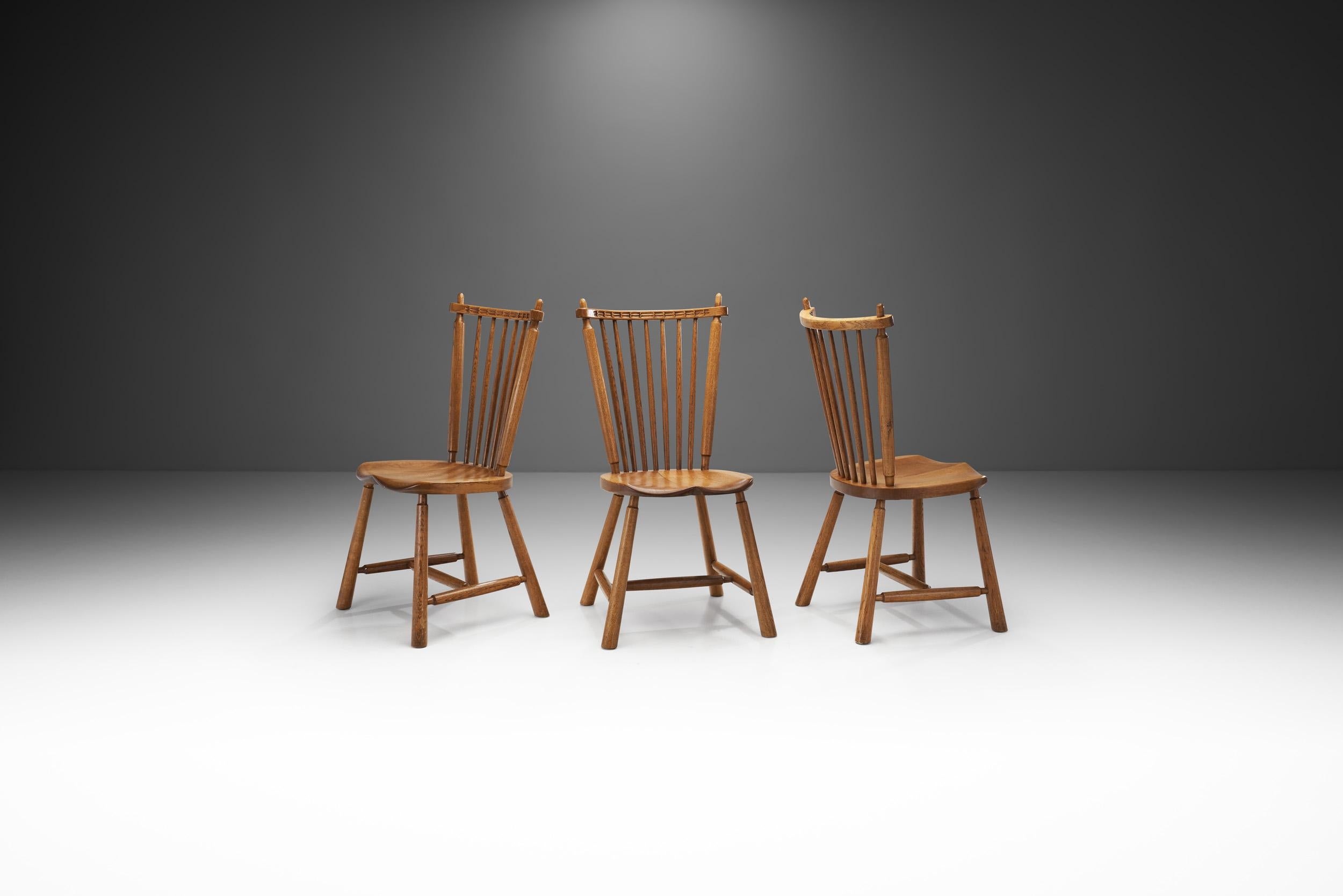 The Dutch manufacturer, De Ster Gelderland from the centre-east of the Netherlands produced many of the most well-known Dutch chairs of the mid-20th century. Their expertise in woodworking is evident in this trio of chairs, with precisely sculpted