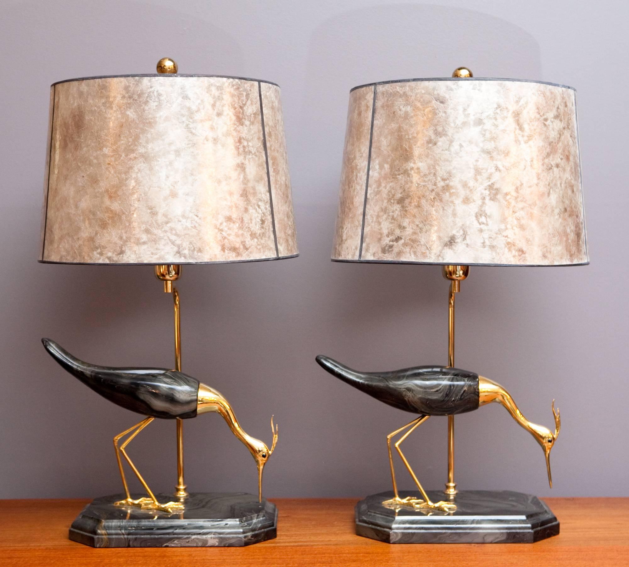 Exquisite and rare *new old stock* bird lamp by De Stijl Firenze, made in Italy, circa 1960s. These gorgeous lamps feature two slightly different herons carved out of strobo wood and hand decorated with swirled paint in emerald green, black, and