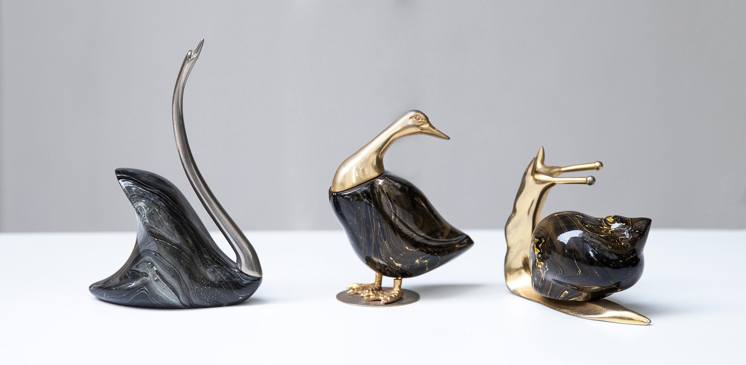 De Stijl animal sculptures, carefully crafted with silvered and gilded metal and carved painted wood. This animals have realistic postures and and a De Stijl label underside
