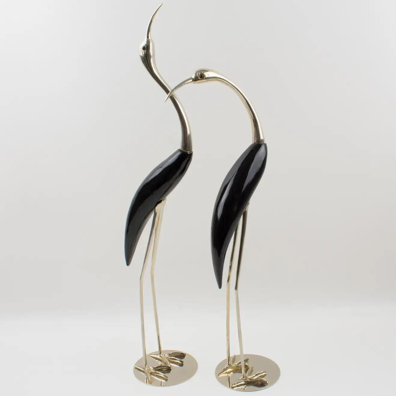 This beautiful pair of large birds, egret or wader, was designed and manufactured by Italian company De Stijl in Firenze in the 1970s. Each bird is carefully hand-crafted with silvered metal and glossy polished black lacquered carved wood. Each bird