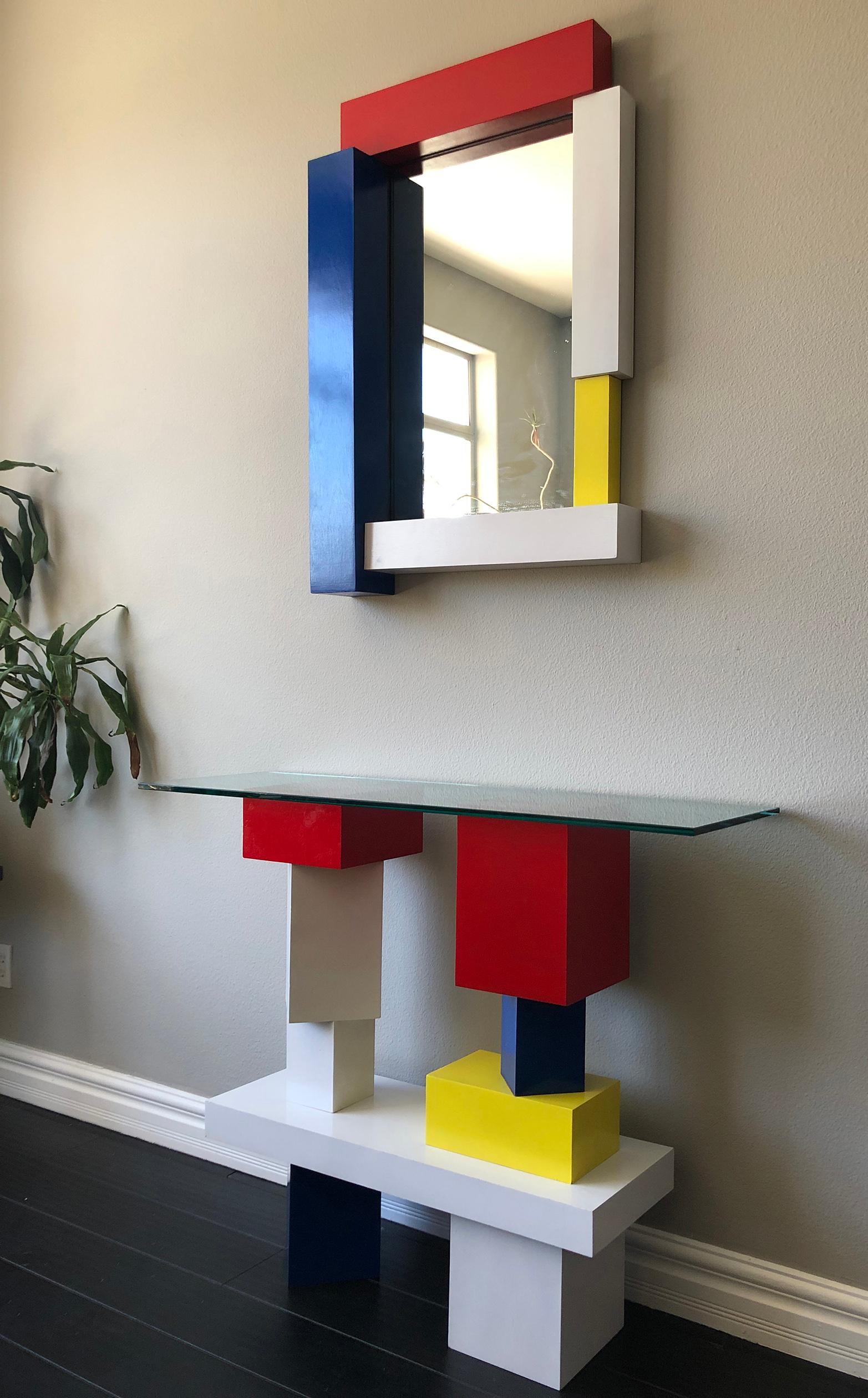 An absolutely stunning pieces of furniture, these pieces are both equally as artistic as they are functional. The console table has an incredibly modern, Piet Mondrian and De Stijl vibe with an almost postmodern, Memphis Milano flair. Would look
