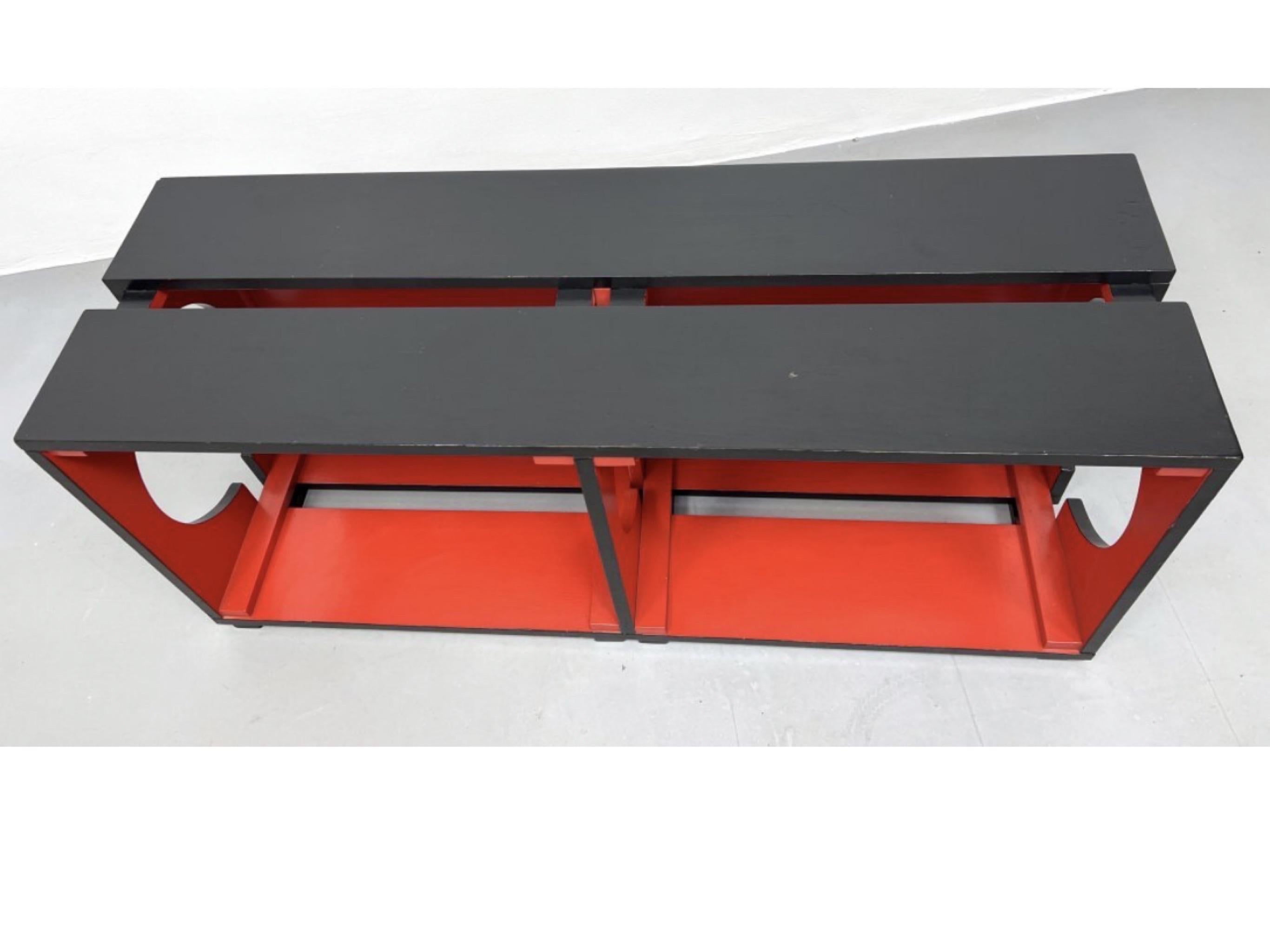 Postmodern De Stijl style low console. This would look great mounted as a floating console, on the floor, or sitting on top of a taller console. 

De Stijl style low console table. Red and black. Dimensions: H: 19.5 inches: W: 48 inches: D: 16.5