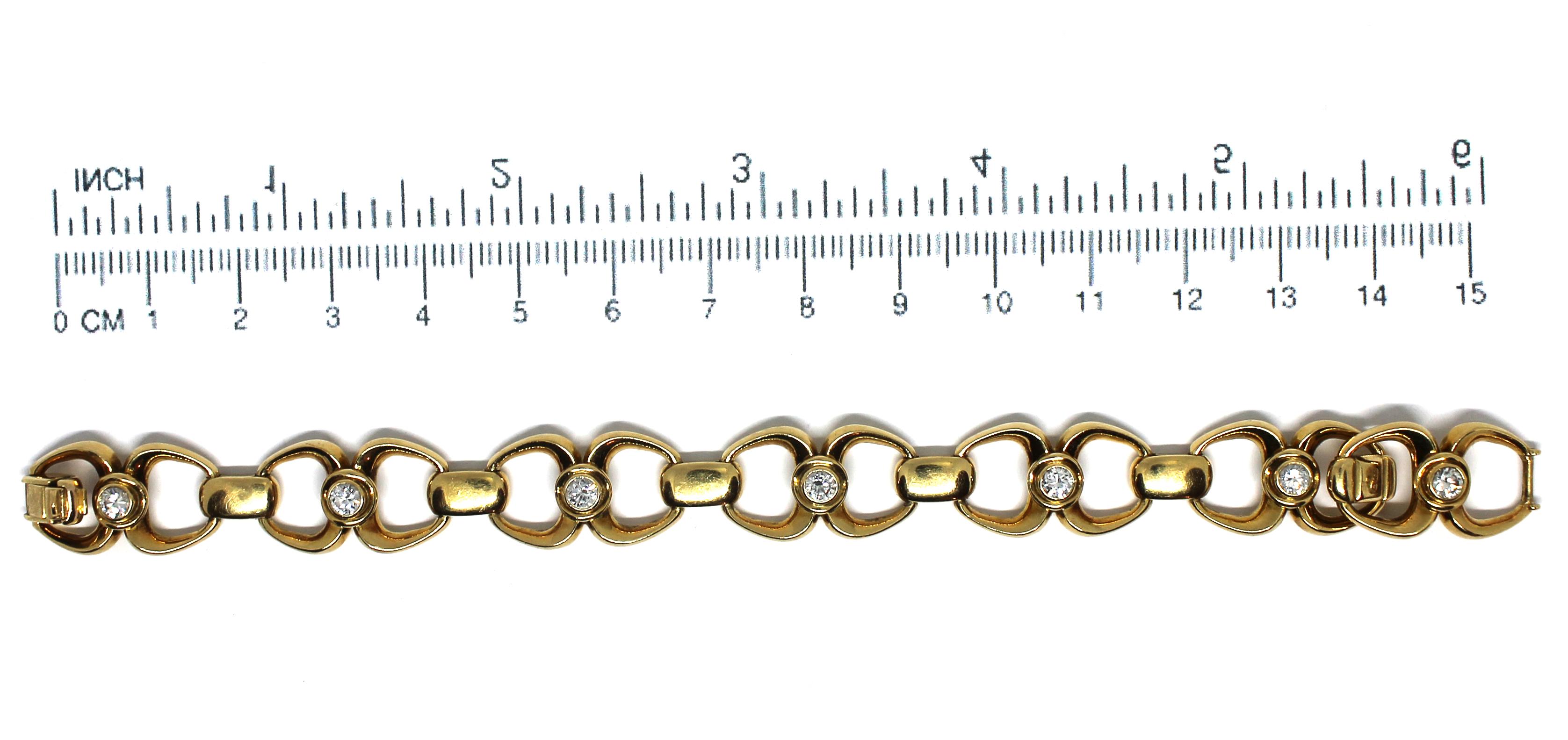 An elegant De Vroomen diamond & gold bracelet signed and dated 1979.  The uniform of series of 18 carat yellow gold fancy-links, accented by collet-set brilliant-cut diamonds, diamonds approx. 0.70ct total, maker's mark LDV, London hallmark, length