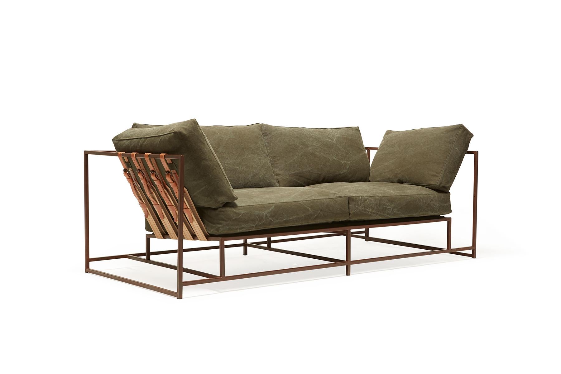 The Inheritance Two Seat Sofa by Stephen Kenn is as comfortable as it is unique. The design features an exposed construction composed of three elements - a steel frame, plush upholstery, and supportive belts. The deep seating area is perfect for a