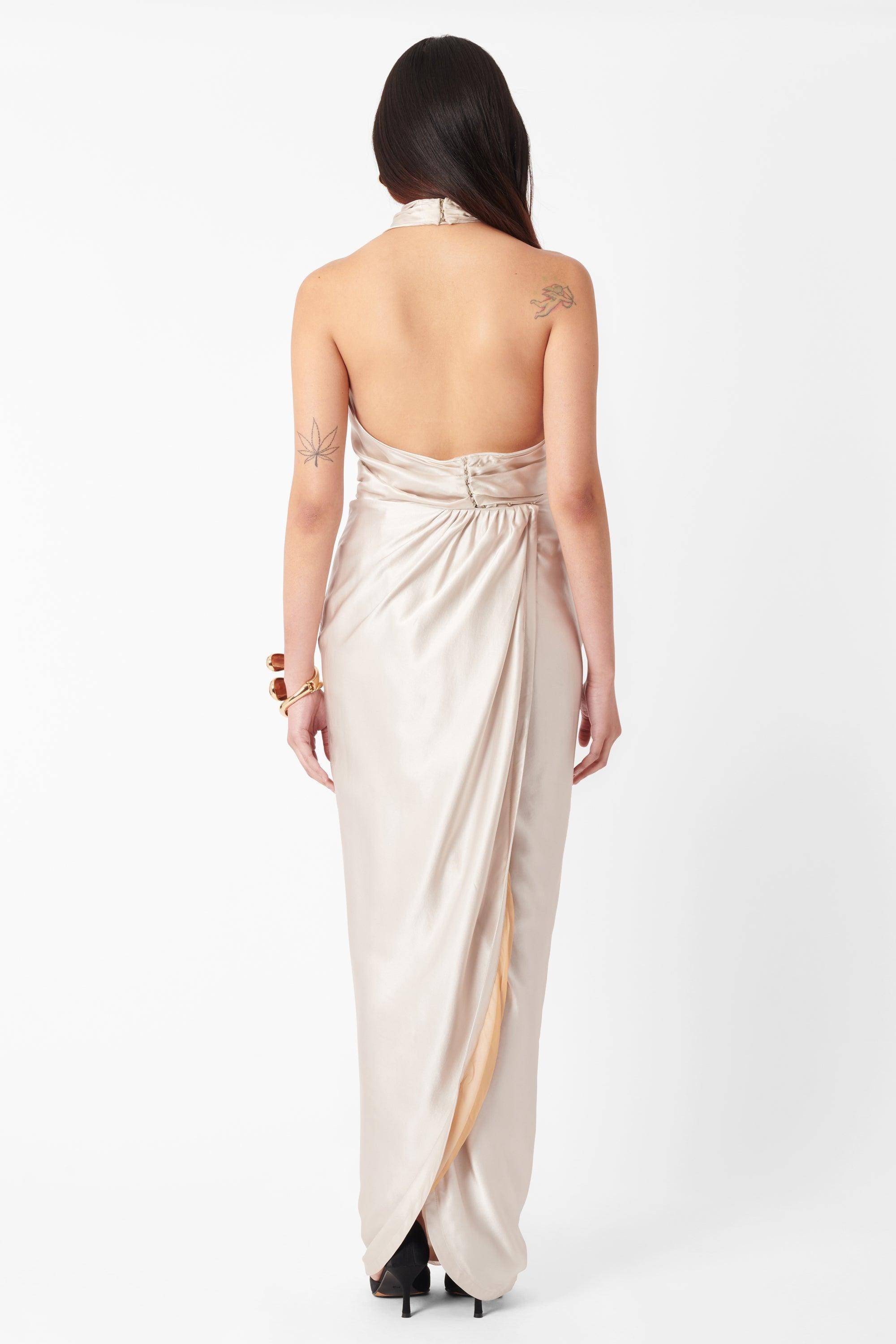 Vintage Deadstock Roberto Cavalli F/W 2007 Silk Halterneck Dress. Dress features a high halterneck, low scoop back and all over ecru silk with a gold chiffon lining. Fastened with a line of hook and eye closures at the neck and back of the dress.