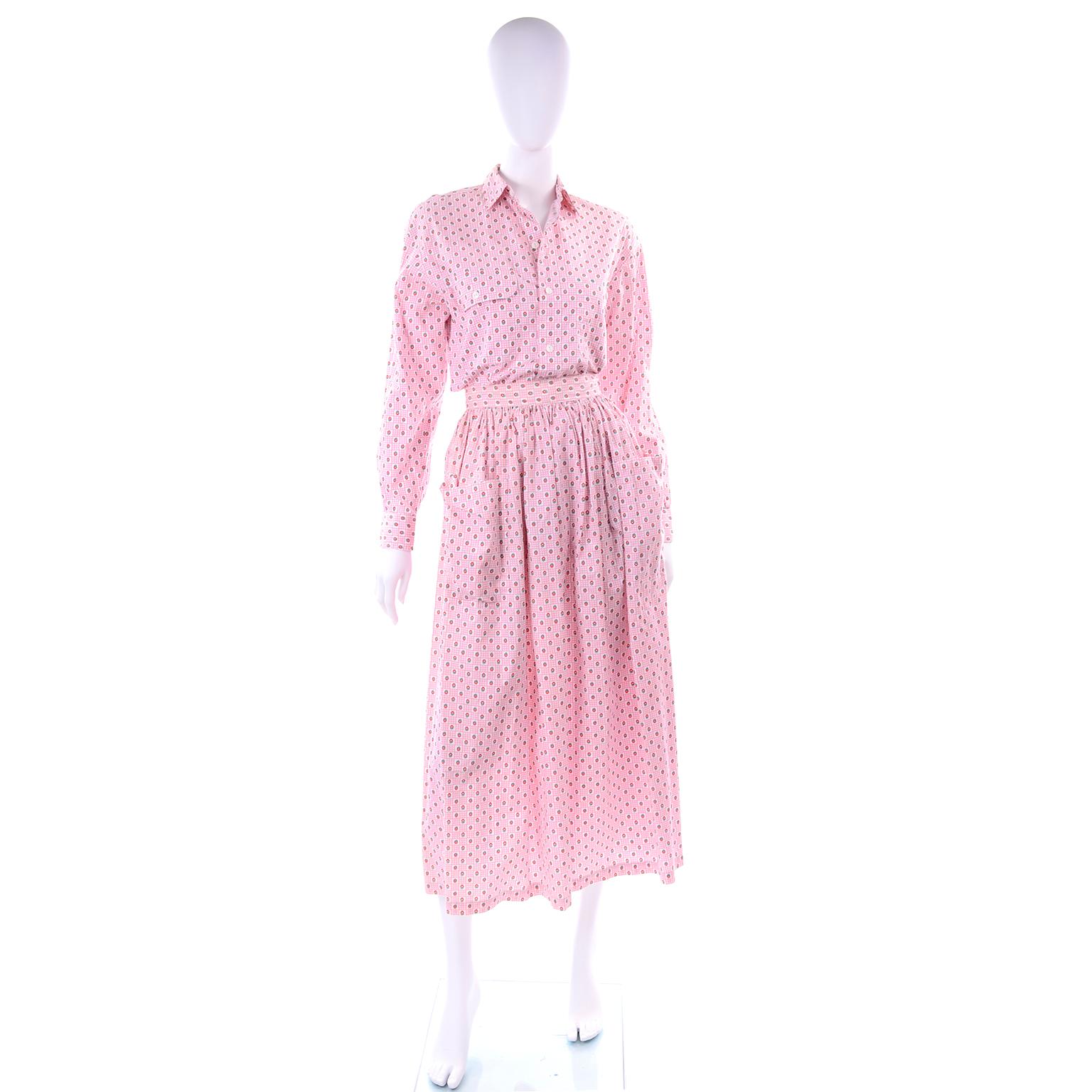 This is a pretty vintage 2 piece dress outfit from Ralph Lauren in a pink floral cotton print.  The outfit is new with original tags attached and includes a button front blouse and a skirt with 2 front pockets. The skirt closes with a zipper and