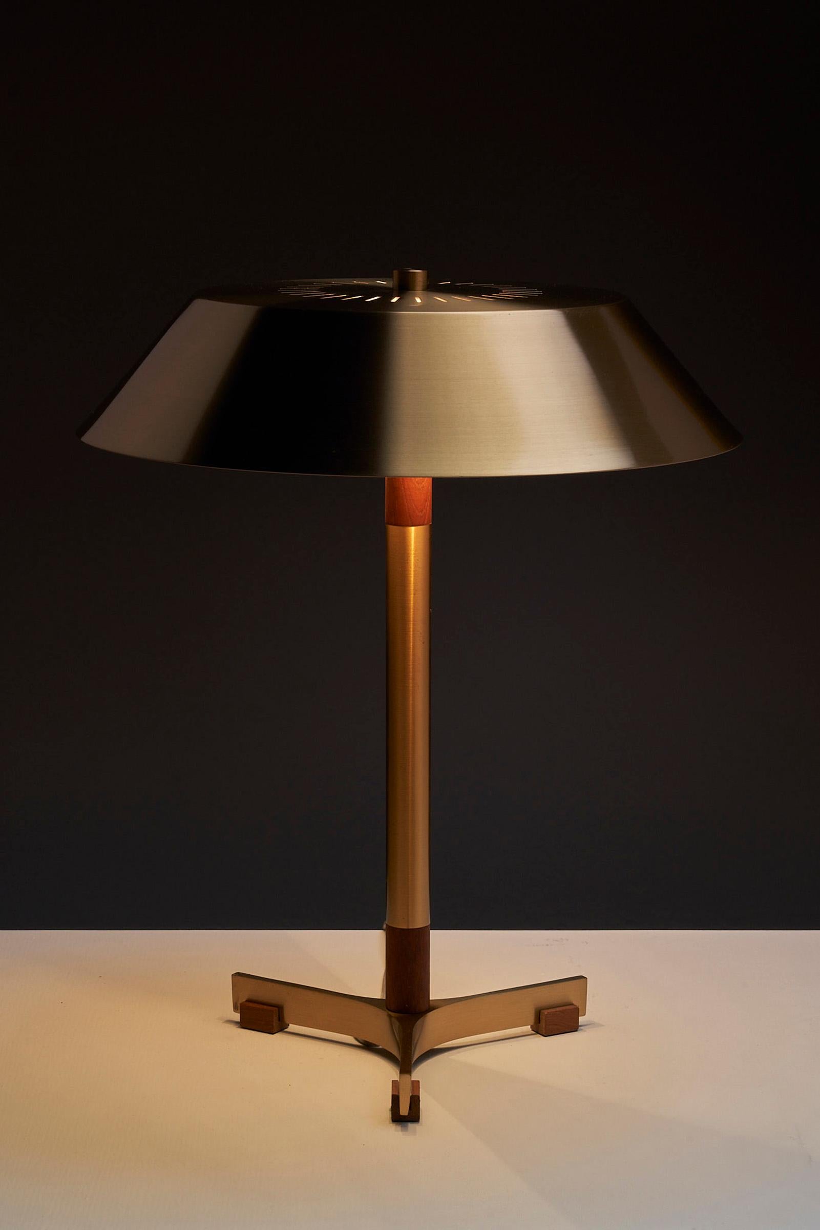 Presenting the epitome of Danish design from the 1960s, the 'President' lamp designed by Jo Hammerborg for Fog & Mørup is a true gem that exudes timeless elegance. Crafted with meticulous attention to detail, this lamp showcases the perfect blend of