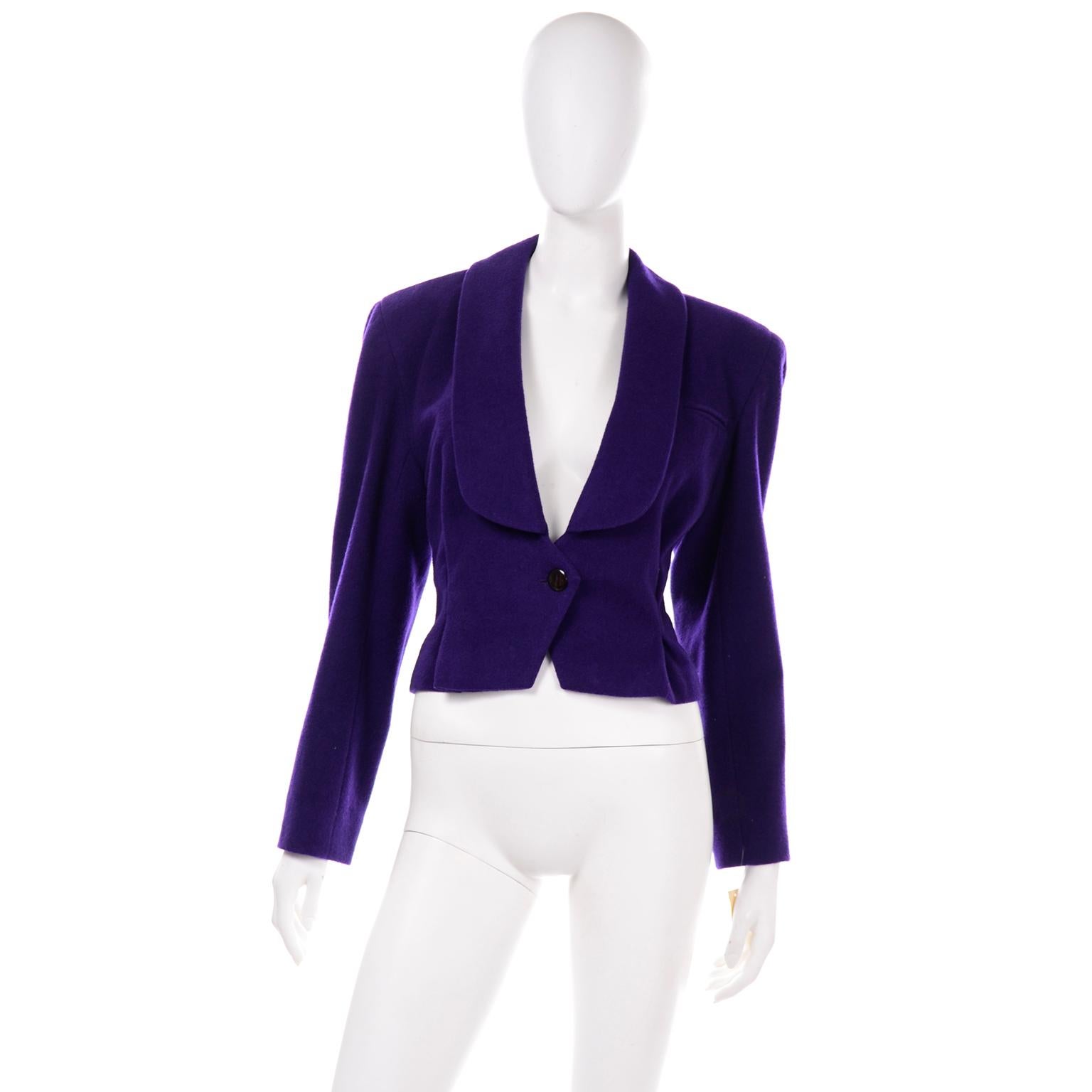 This Norma Walters cropped wool jacket is so fabulous! The wool + cashmere blend is in a rich purple and this piece is sure to elevate any outfit. There is a front button closure and one small faux breast pocket. There are two darts on the front of