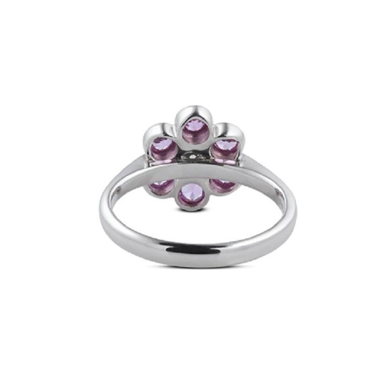 DEAKIN & FRANCIS, Piccadilly Arcade, London

This beautiful 18kt white gold cluster ring features 6 stunning round pink sapphire gemstones and a dazzling central brilliant-cut diamond. This ring is hallmarked for authenticity and is UK ring size N.