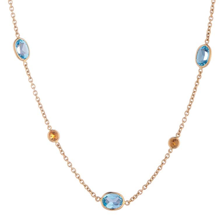 DEAKIN & FRANCIS, Piccadilly Arcade, London

This one of a kind 18ct yellow gold blue topaz and fire opal necklace is sure to turn heads. Comprised of 8 oval blue topaz gemstones and 7 brilliant cut fire opals. The perfect gift for those who are
