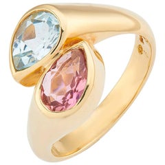 Anillo Deakin & Francis de oro amarillo de 18 quilates con topacio azul y turmalina rosa