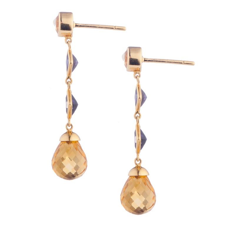 DEAKIN & FRANCIS, Piccadilly Arcade, London

These lovely 18ct yellow gold citrine and iolite drop earrings are the perfect accessory, day or night. Comprising of a faceted collet citrine, two princess cut iolites and a briolette citrine drop.