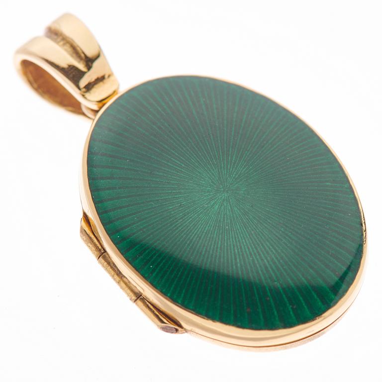 DEAKIN & FRANCIS, Piccadilly Arcade, London

Lockets are a staple jewellery item and should be a part of all jewellery boxes. This beautiful 18ct yellow gold locket has been delicately hand-enamelled in a dark green for a simple and sophisticated