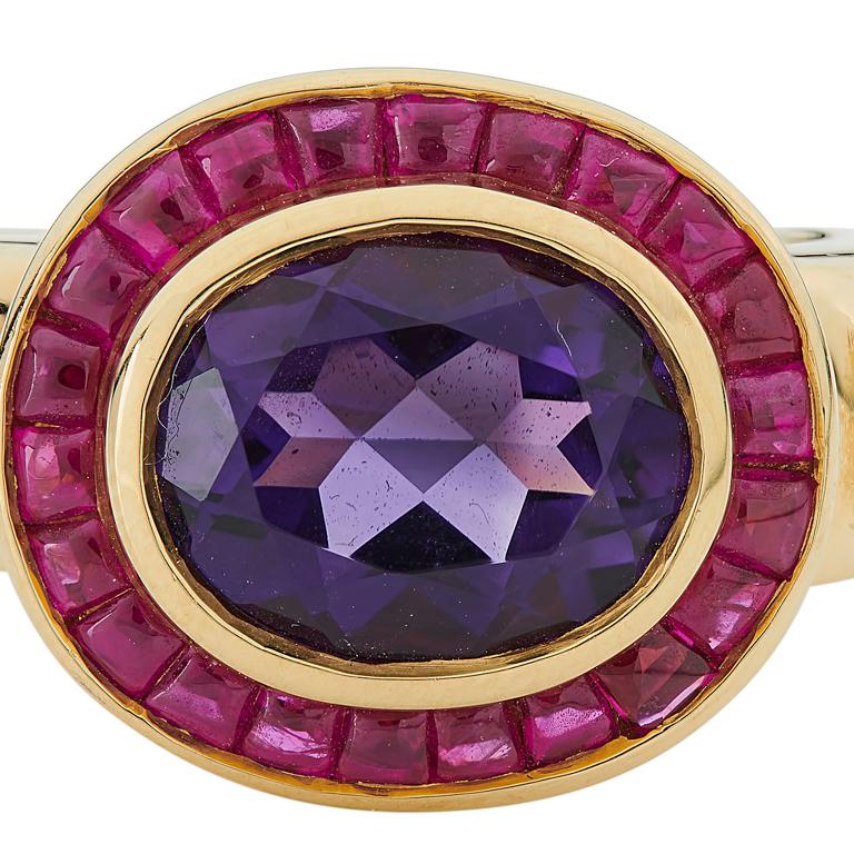 DEAKIN & FRANCIS, Piccadilly Arcade, London

This stunning 18ct yellow gold amethyst and ruby ring is the perfect gift for a loved one! Comprising of a central oval amethyst and a cabochon ruby border. Both stones have been linked to royalty