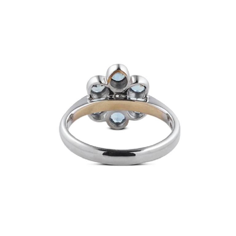 DEAKIN & FRANCIS, Piccadilly Arcade, London

This beautiful 18kt white gold cluster ring features 6 stunning round aquamarine gemstones and a dazzling central brilliant-cut diamond. This ring is hallmarked for authenticity and is UK ring size J.