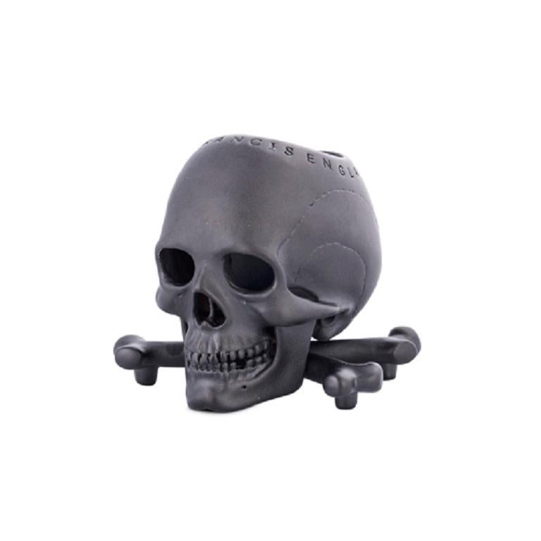 DEAKIN & FRANCIS, Piccadilly Arcade, London

This 'humerus' versatile product can be used for holding your match sticks or a lovely scented candle. This skull and cross bones head is finished off with a stunning matt black, anodised titanium, plated