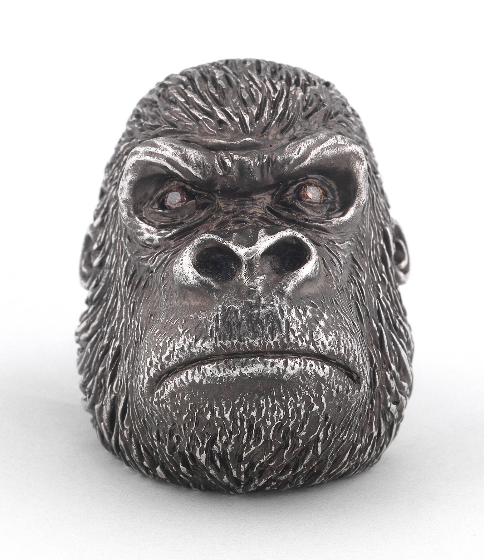


The handmade sterling silver large gorilla ring has been hand carved and blackened with diamond eyes. The gorilla ring is a must for any fashionable gentleman. The ring size is 11 1/2 but it can be resized.