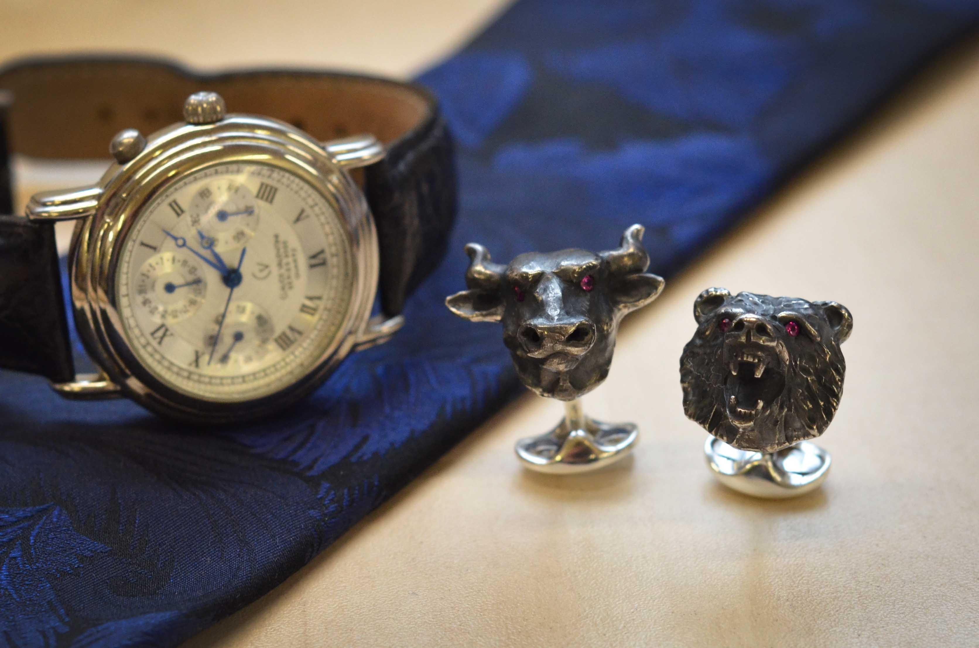 DEAKIN & FRANCIS, PICCADILLY ARCADE, LONDON.

These symbolic beasts of finance worn on the cuff will show that you really mean business. The bull symbolises the rise in the stock market whereas the bear signifies a slow decline. The ruby eyes