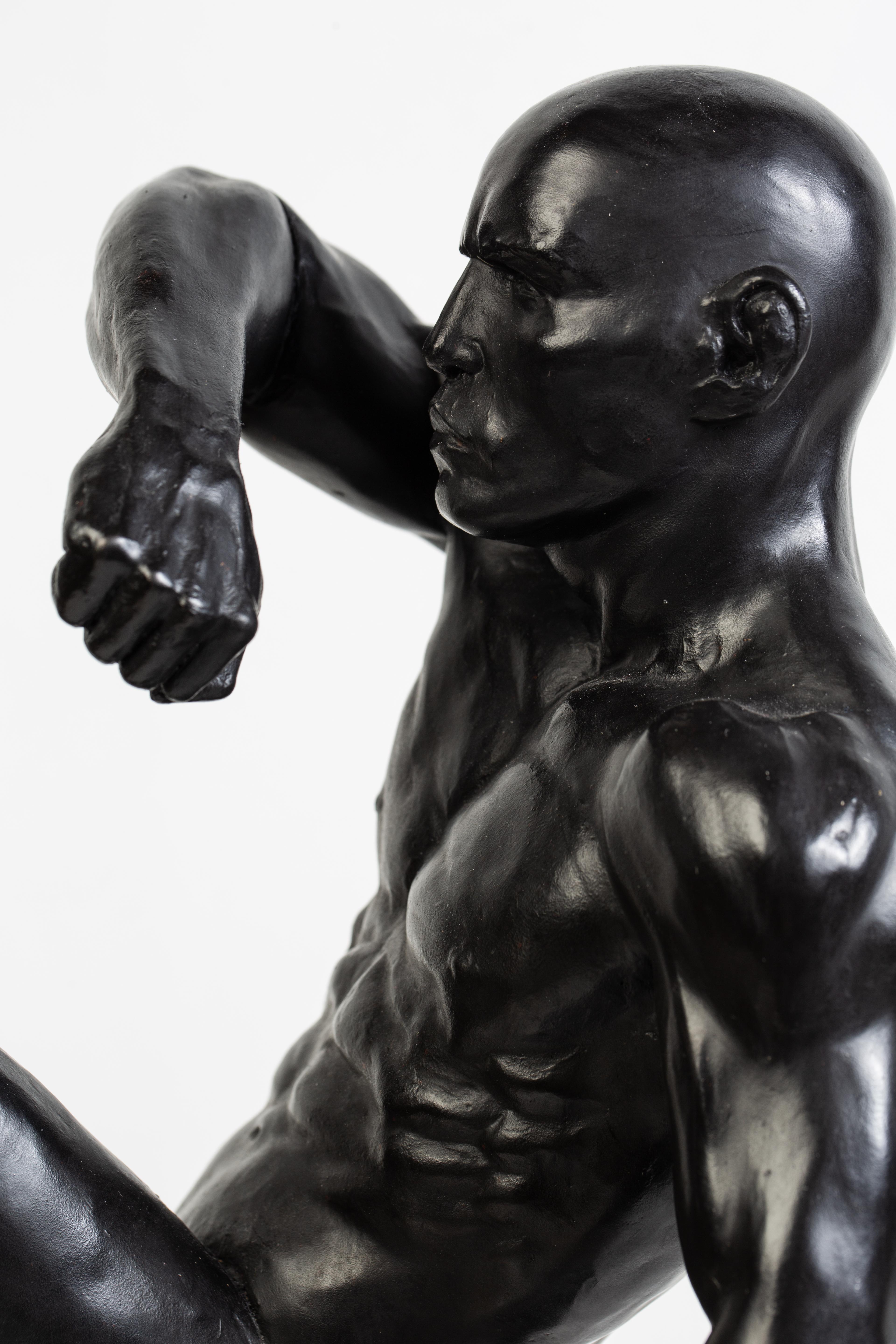 The beauty of the human form is captured is this dynamic bronze sculpture of a Muay Thai Fighter.  

Dean Kugler
This Impact (Muay Thai Fighter)
bronze
18h x 9w x 7d in
45.72h x 22.86w x 17.78d cm

Biography
I became interested in the human form