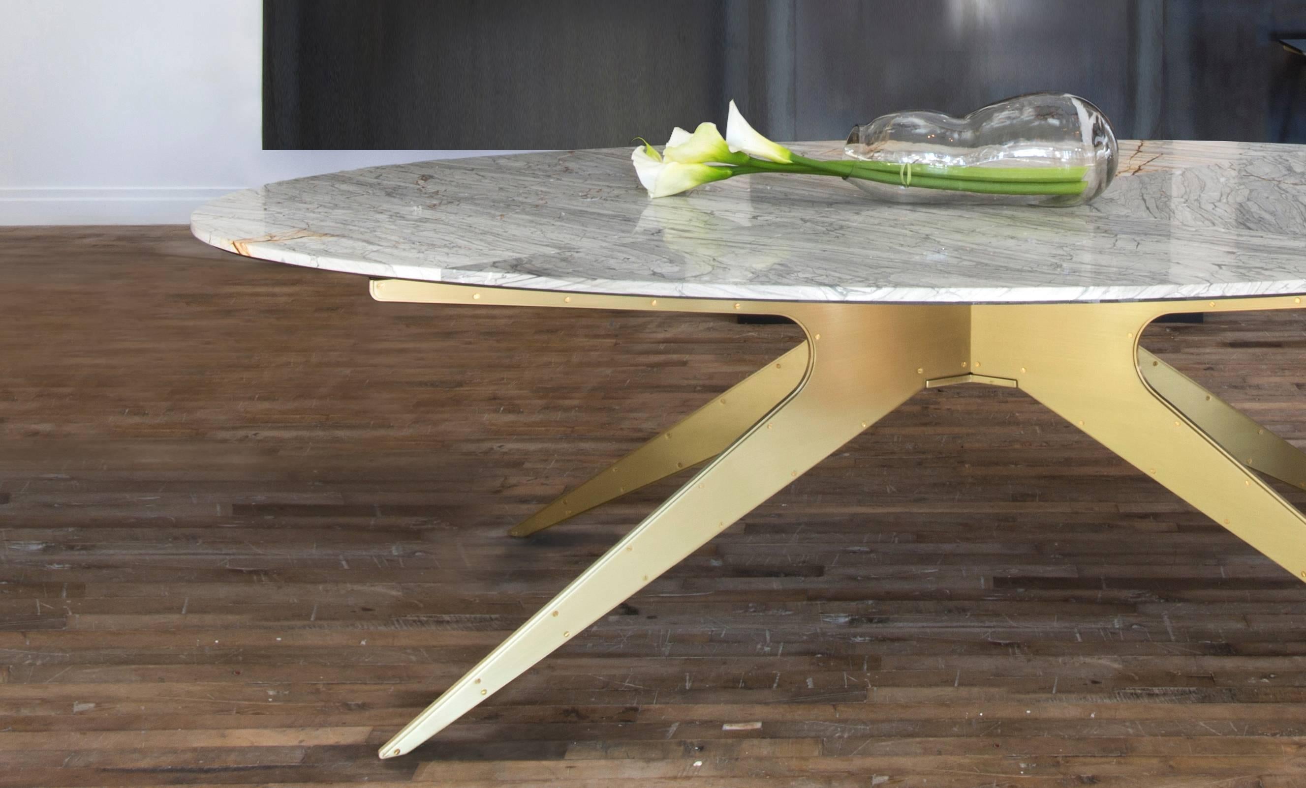 Inspired by silhouettes of Mid-Century
Modern design, the Dean dining table
feature various marble-top options
supported by its bold and sculptural base
below.

Custom sizes are not available. 
Standard metal finishes are Satin Brass, Copper,